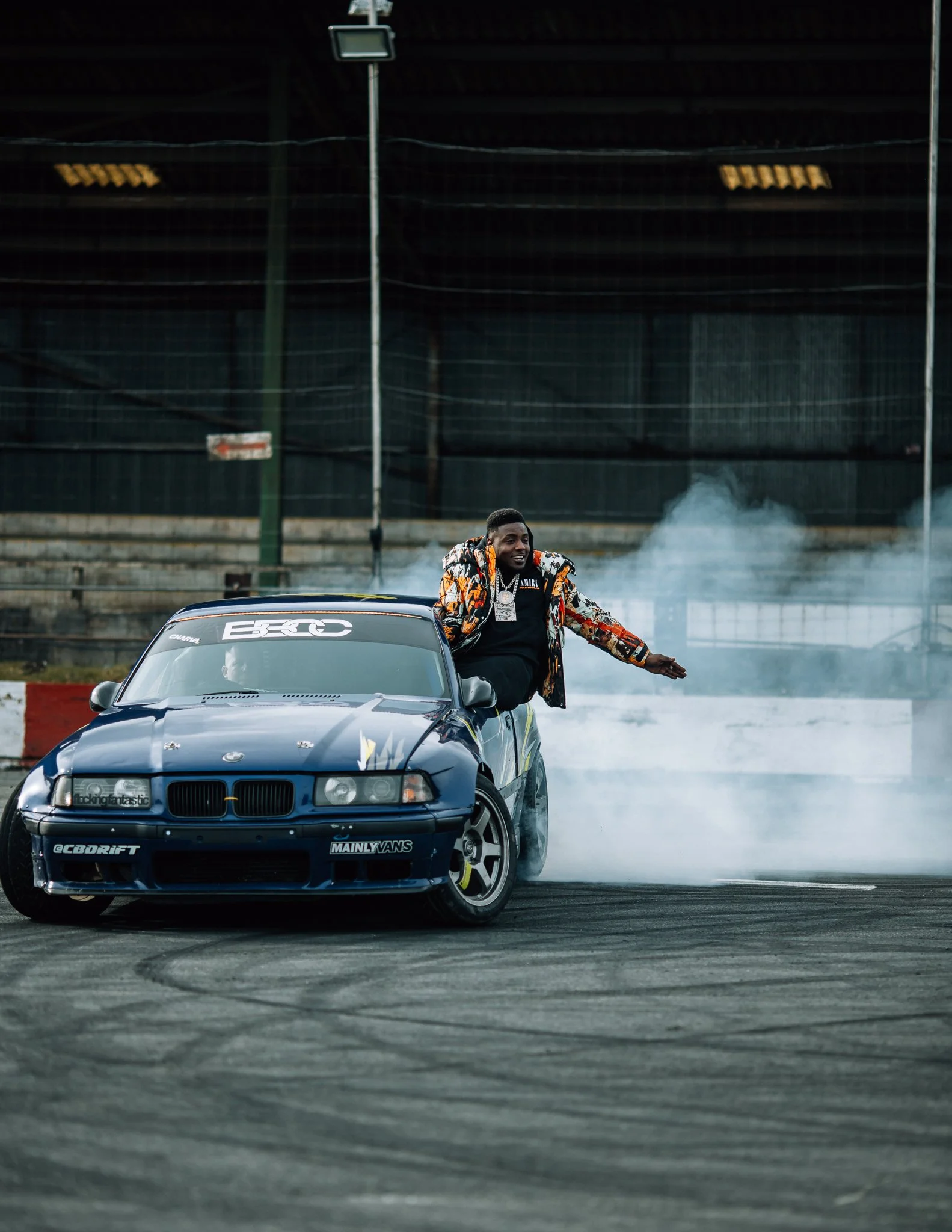  Mist raps out of the side of drifting BMW