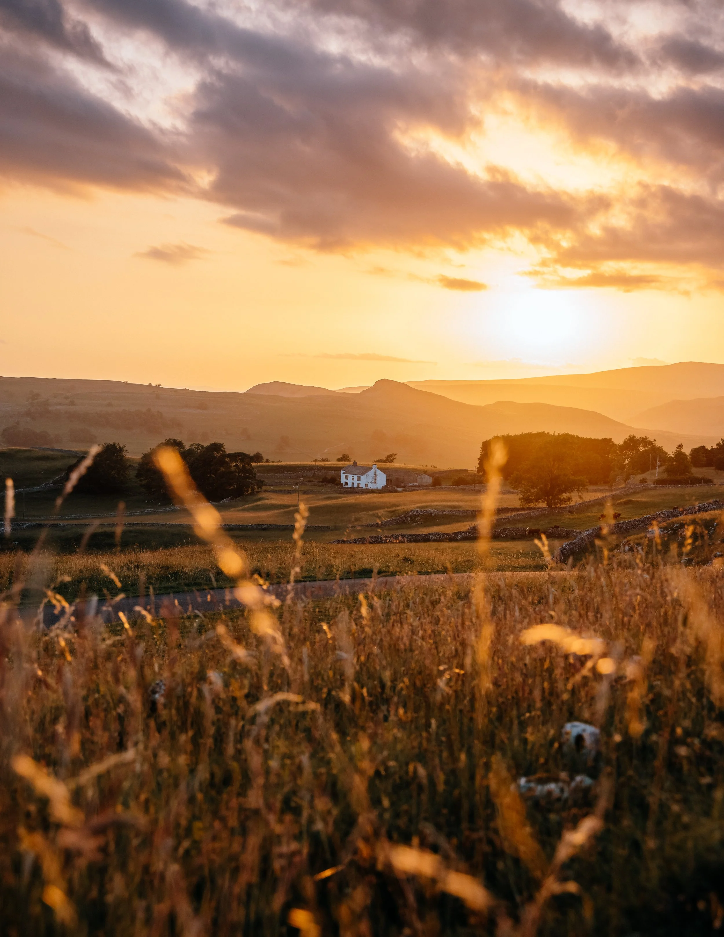 a traditional farmhouse, sunset, summer Yorkshire Dales national Park