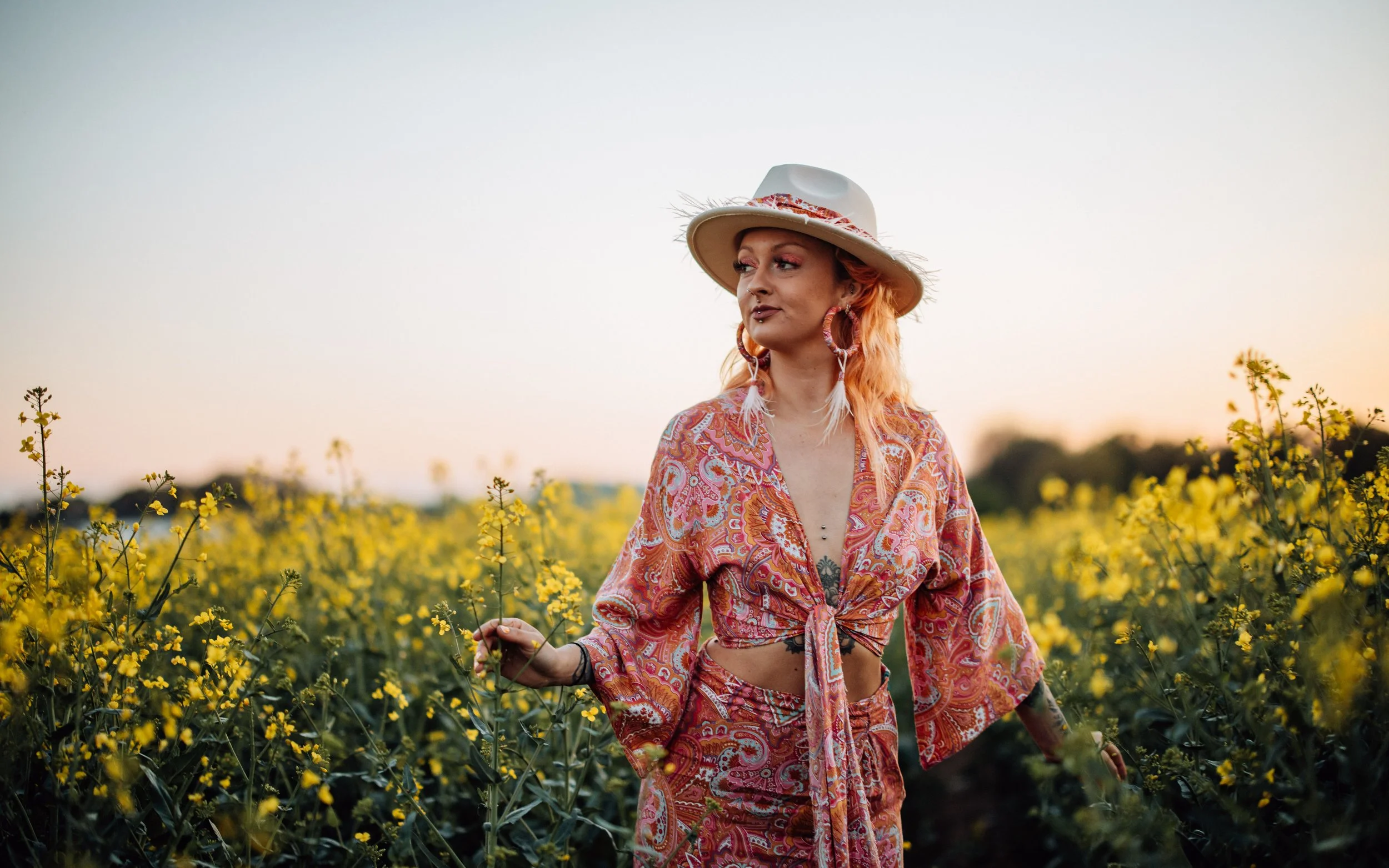  girl in hippie inspired outfit in the field of yellow life