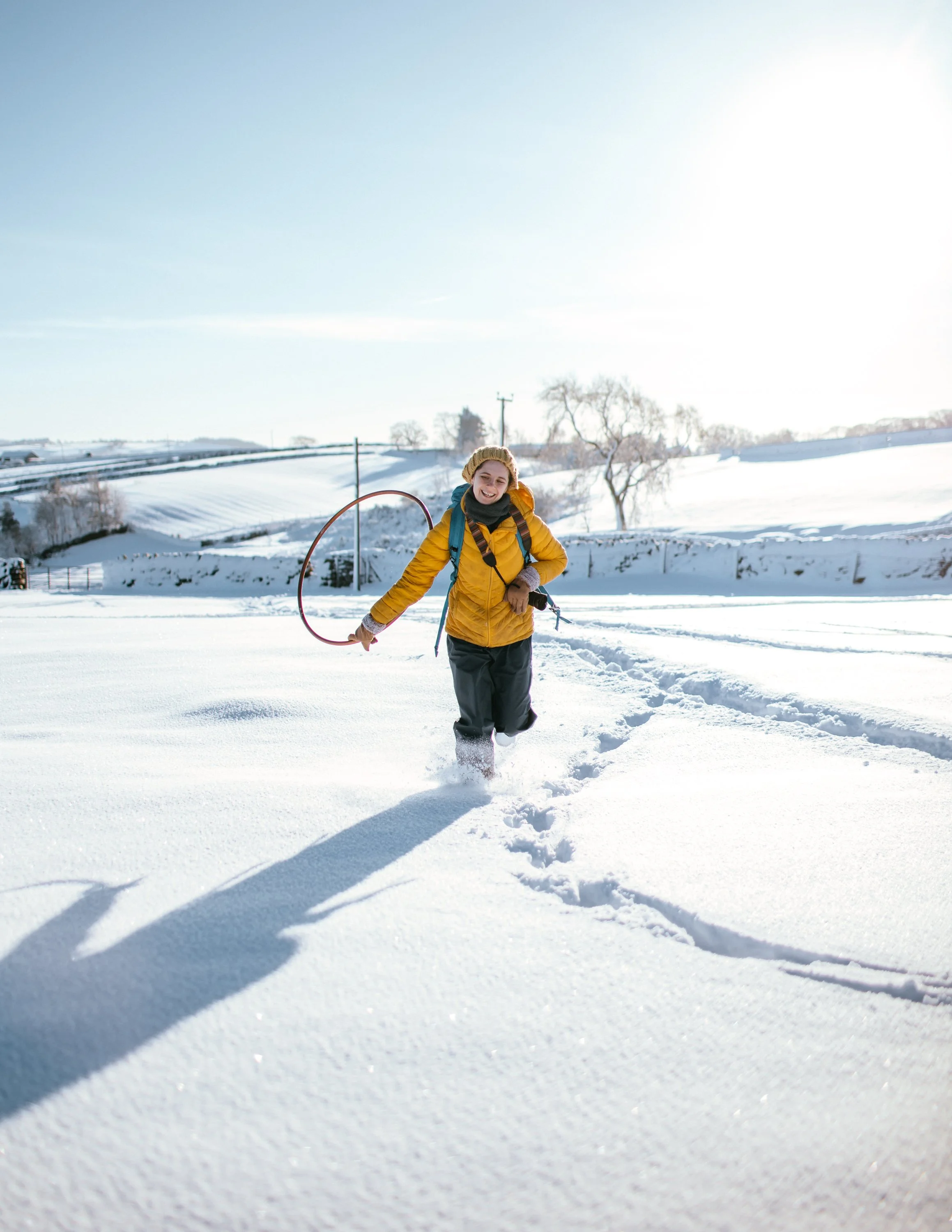  girl runs through snow, Yorkshire Dales