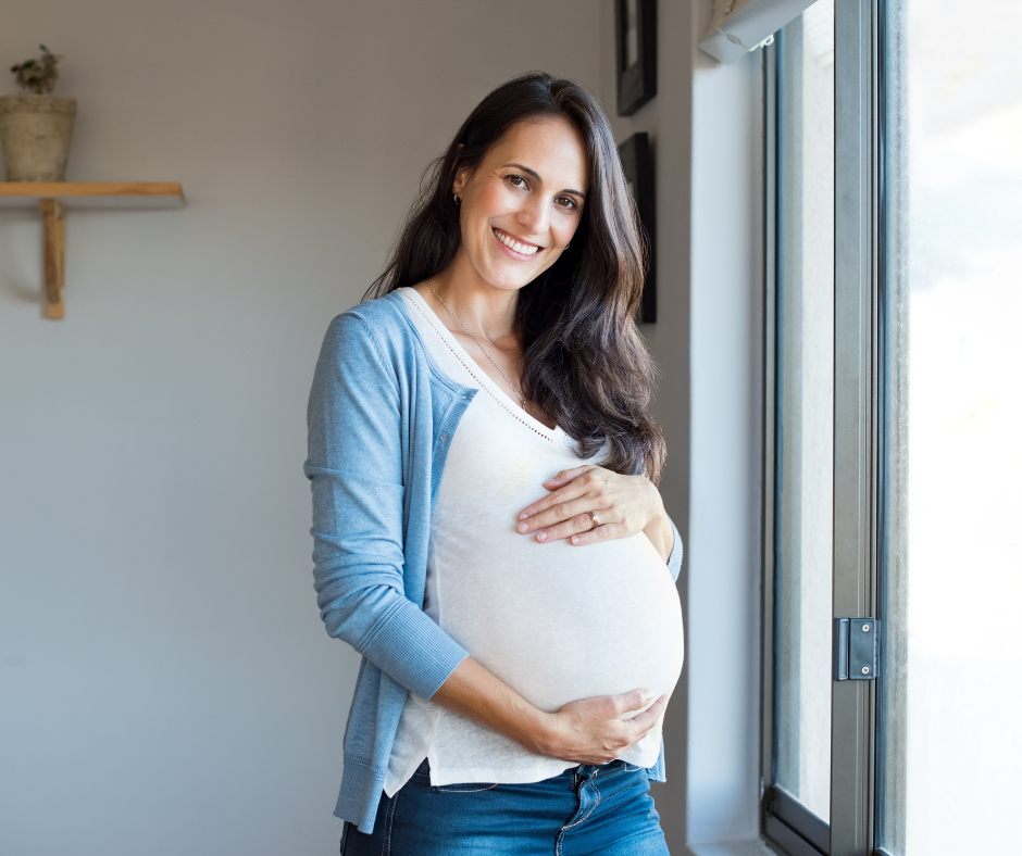 Pregnant lady smiling after chiropractic treatment.png