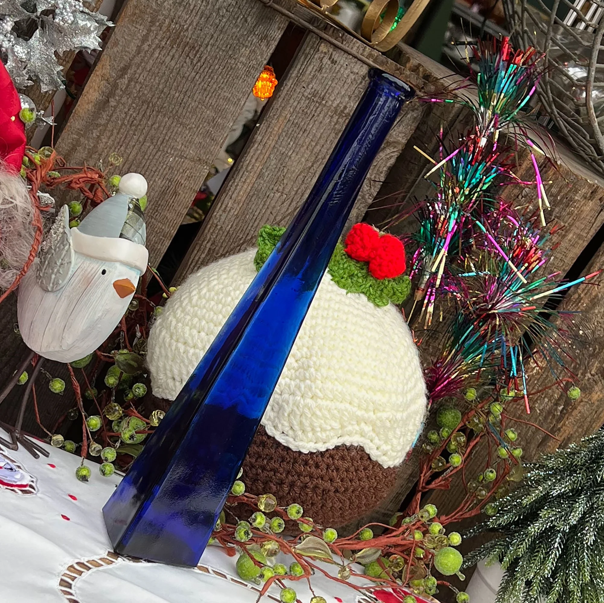 Triangular blue glass bottle