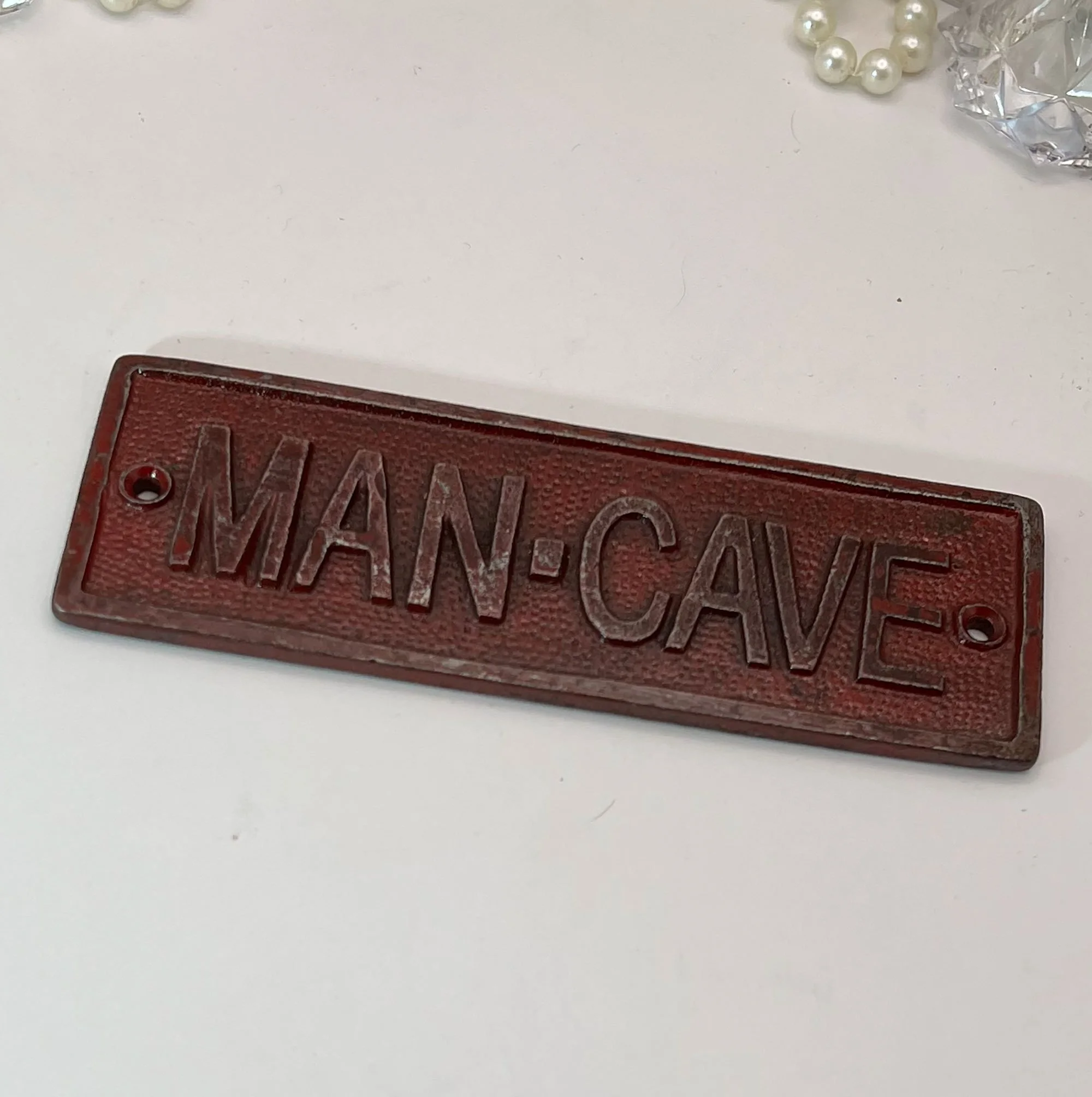 Metal man cave sign