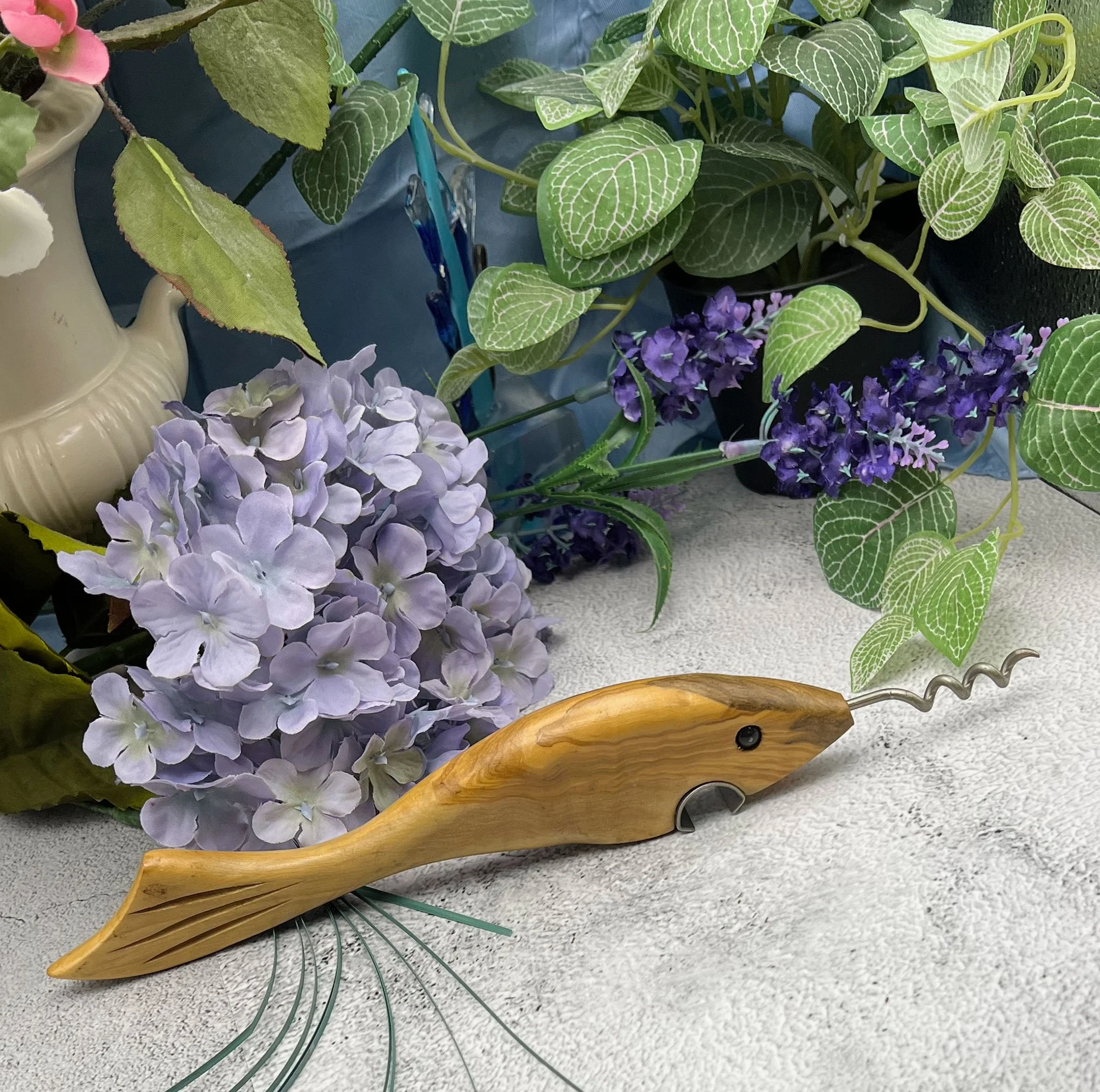 Fish bottle opener and corkscrew