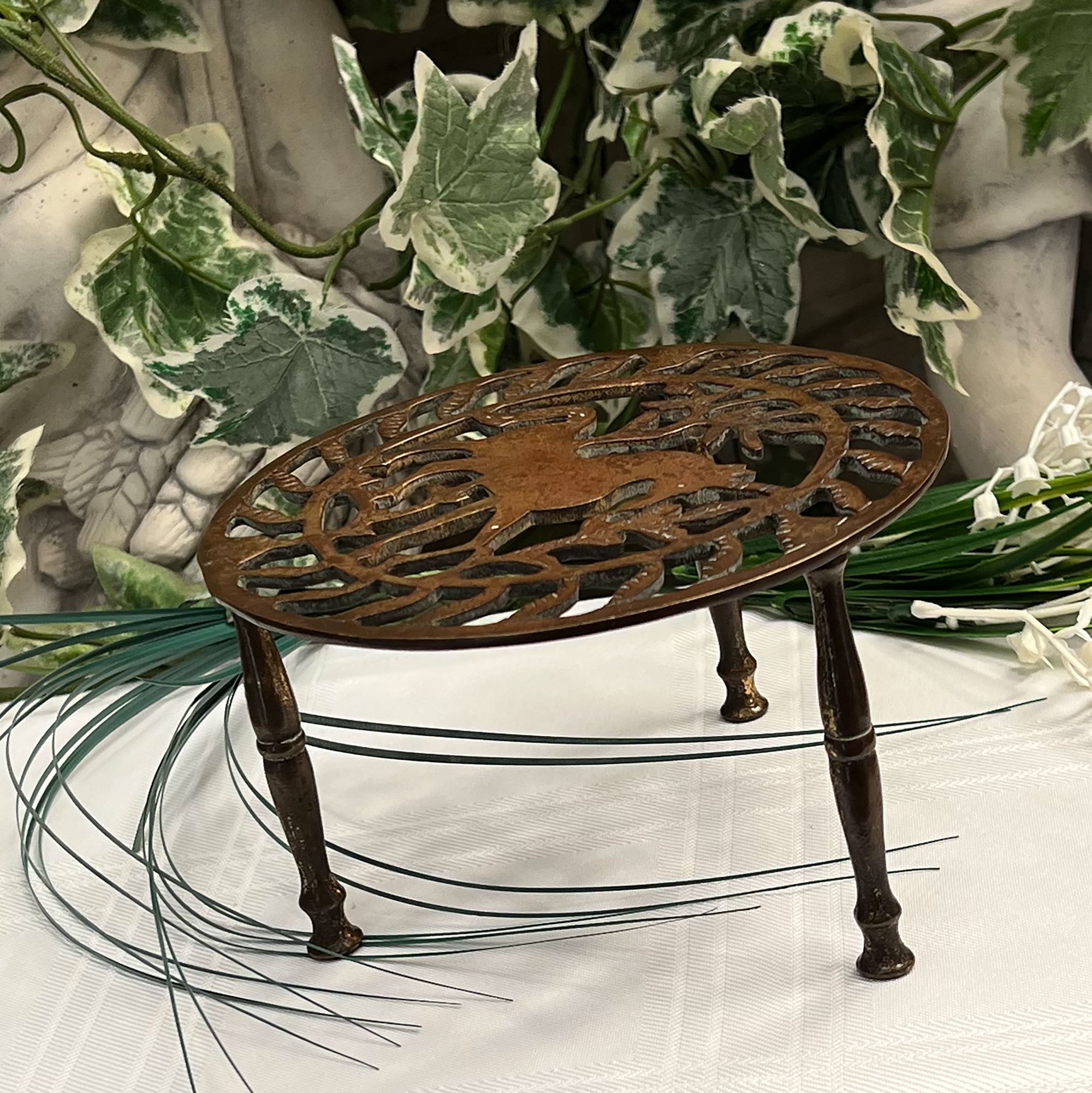 Brass trivet with horse design