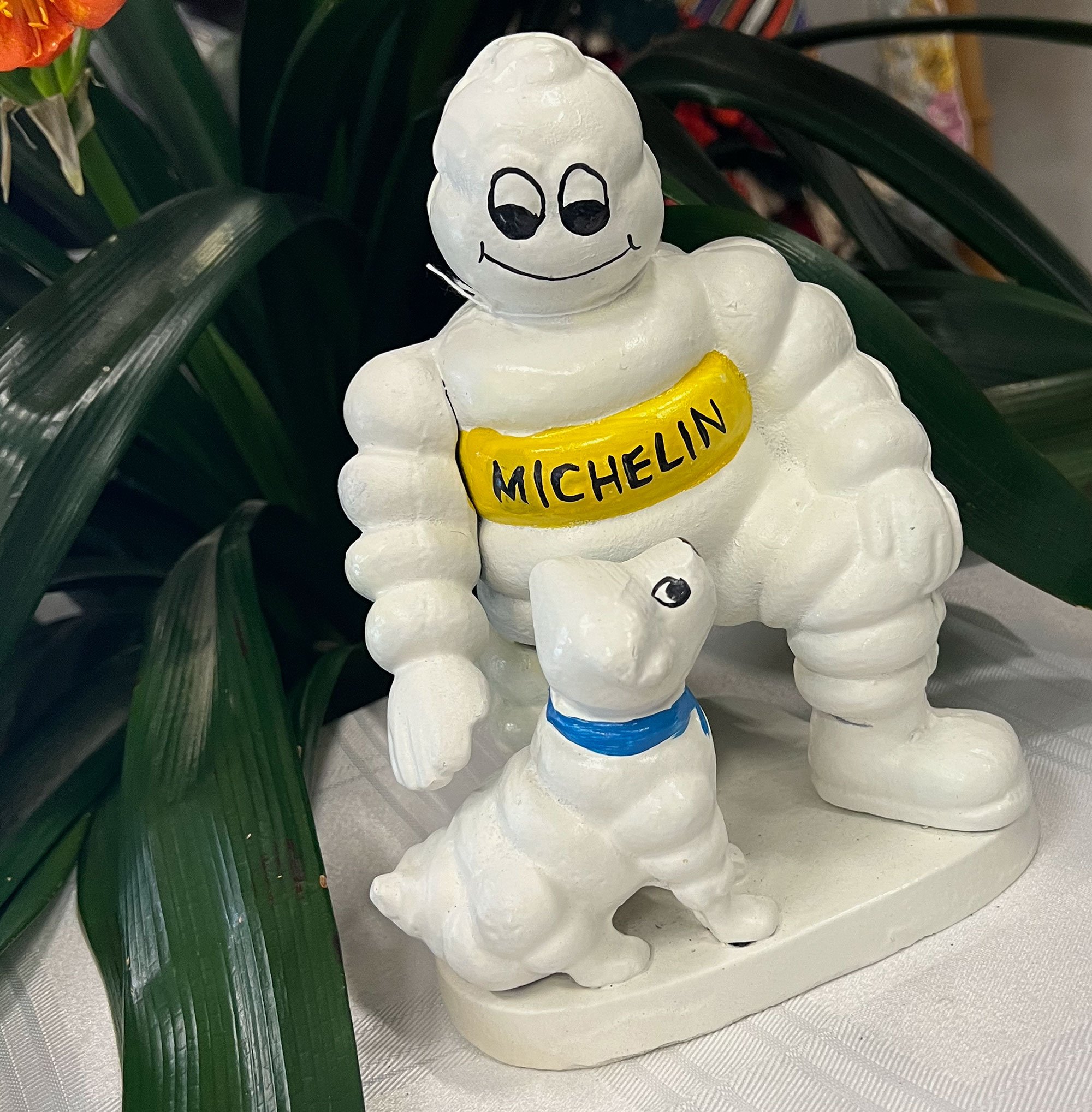 Cast iron Michelin man and dog