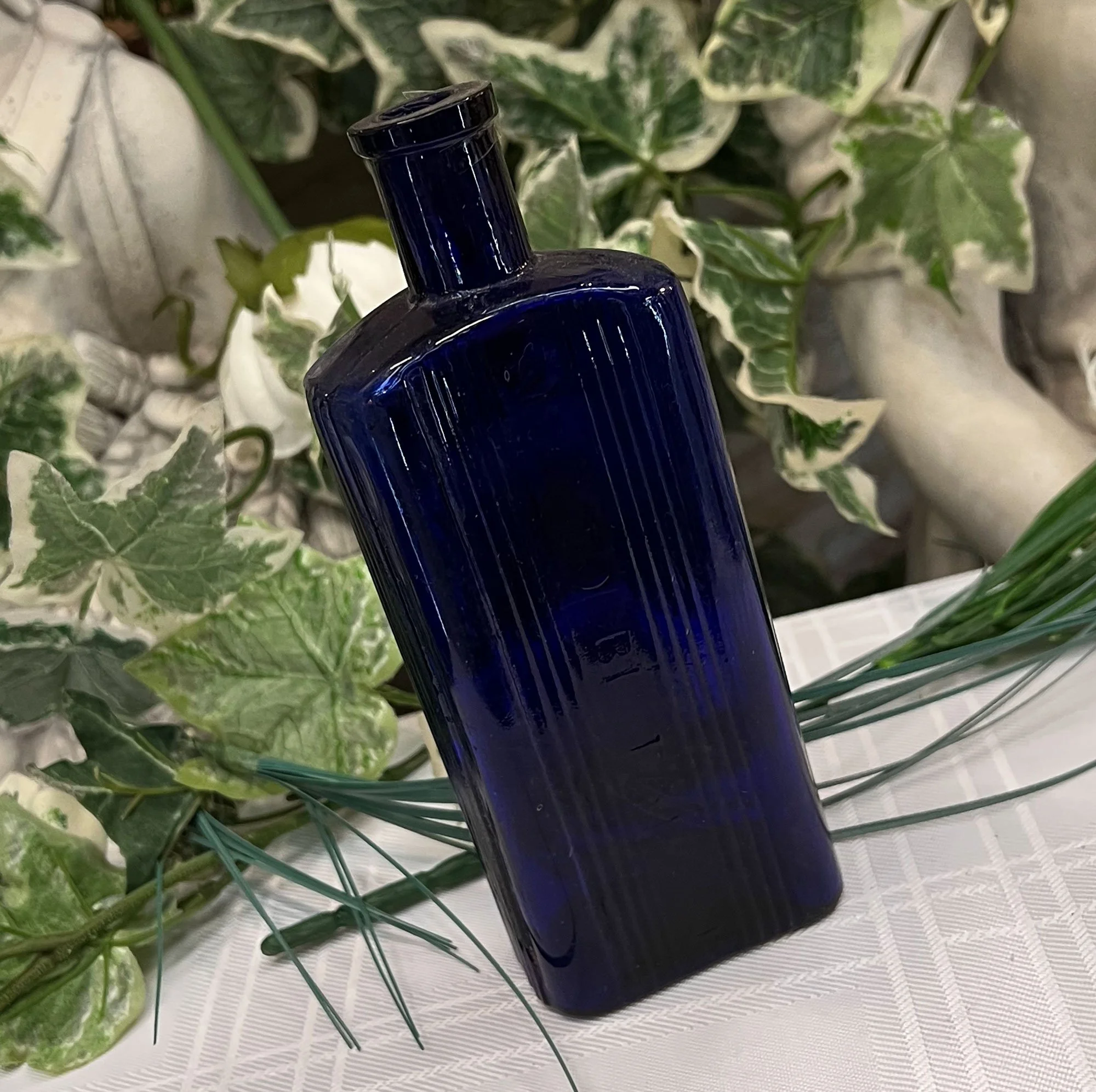 'Not to be Taken' blue glass bottle