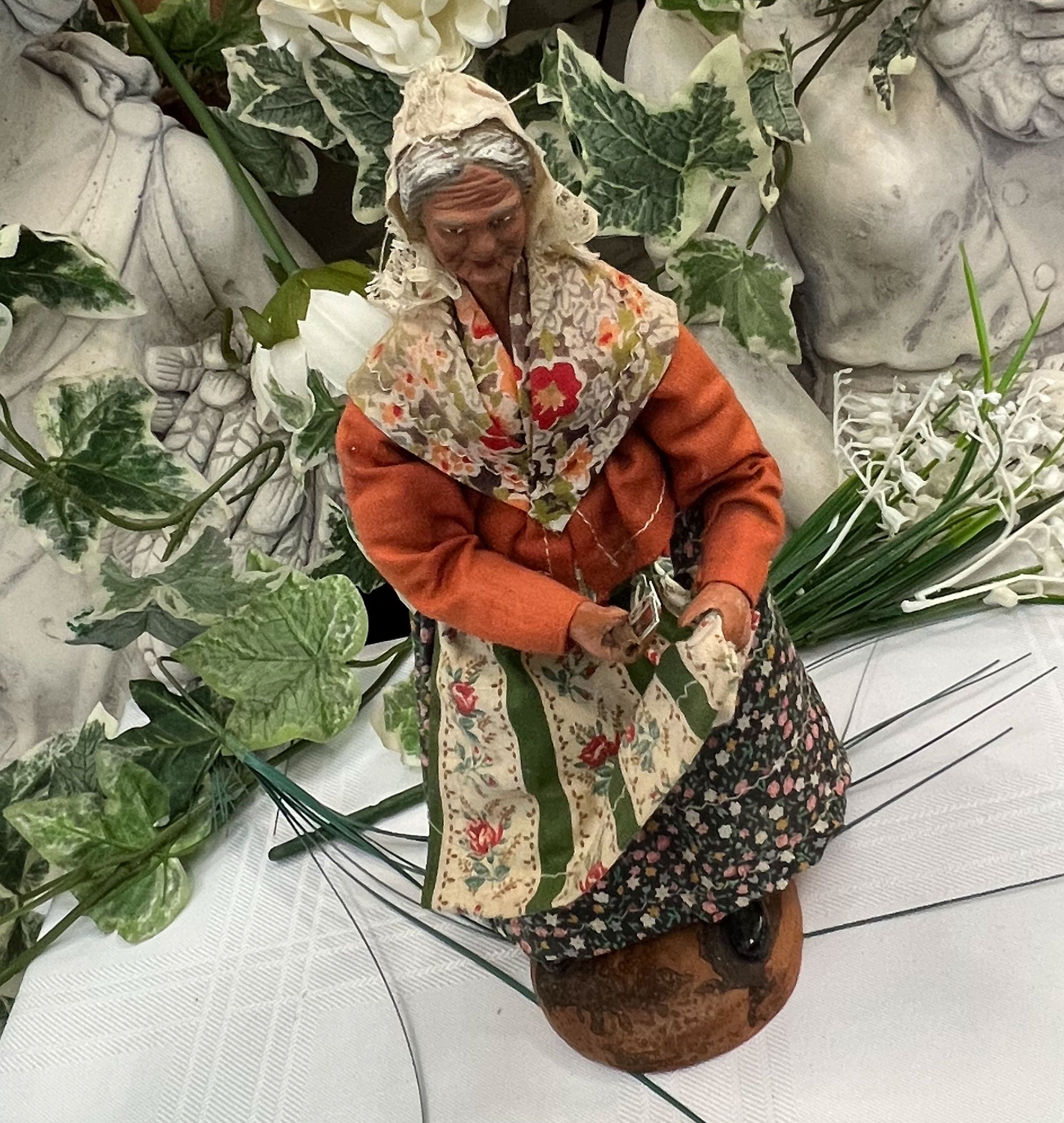 Clay and textile doll figure