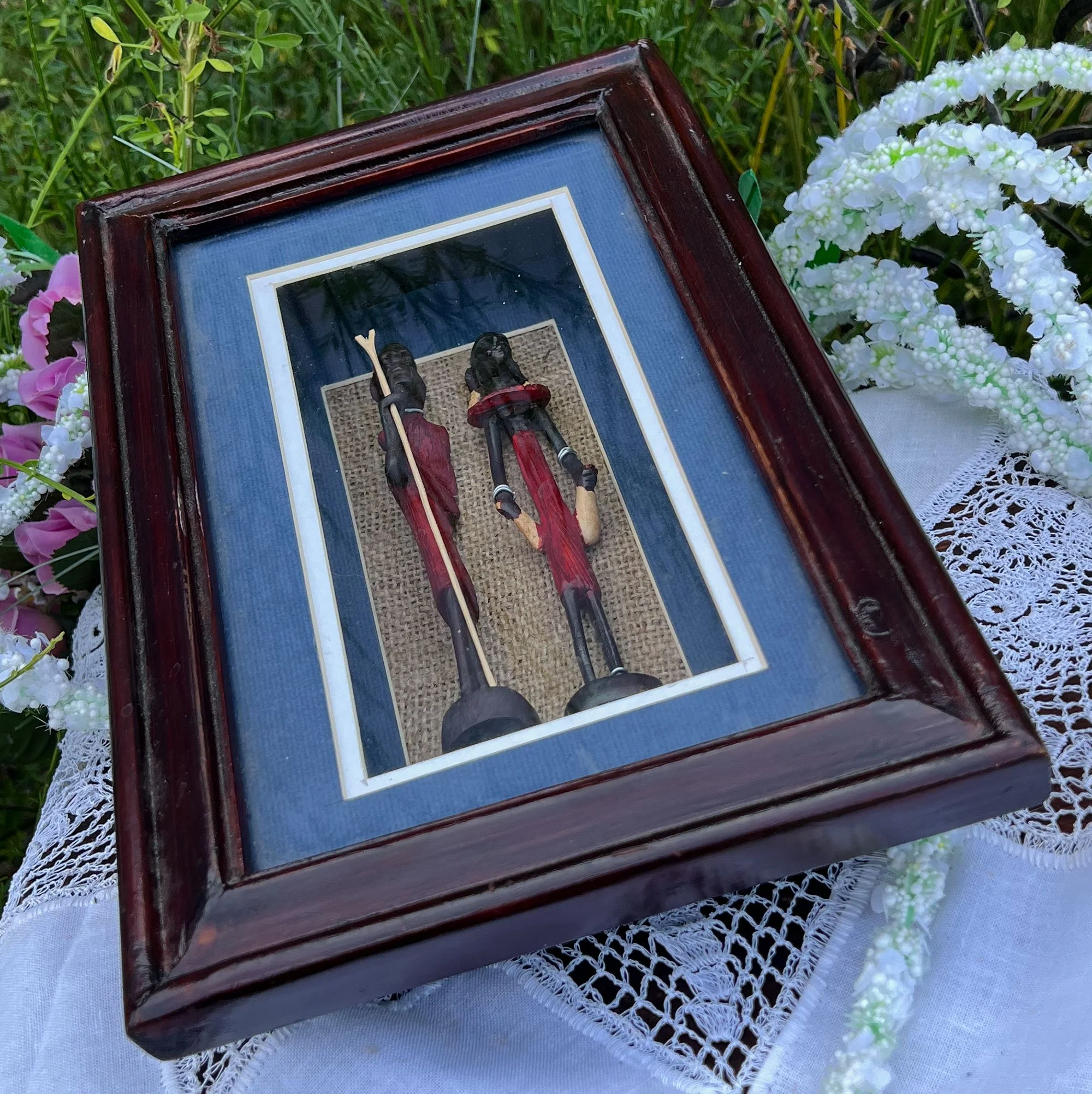 Framed carved wood figures