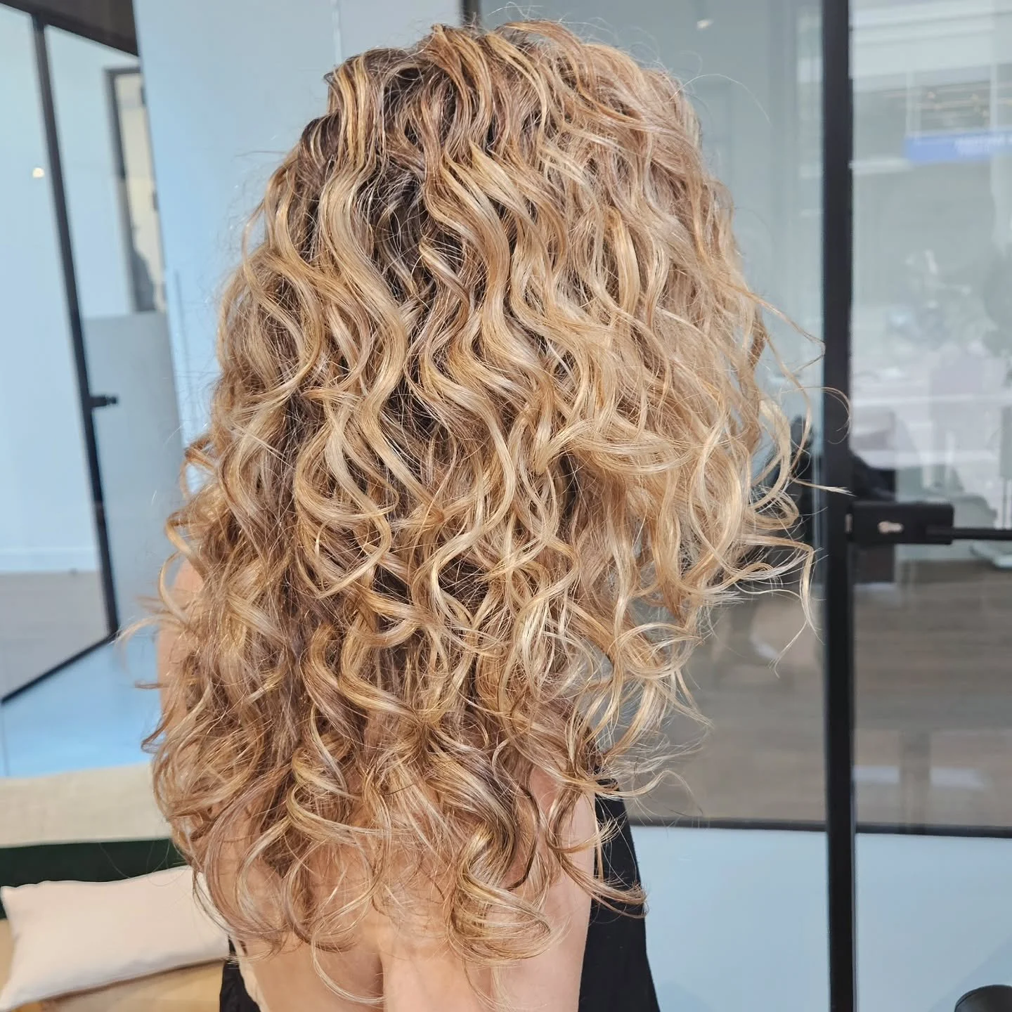 SIGNATURE CURLY HIGHLIGHTS. I love using my special custom technique of curly highlights to add dimension to your curls that will grow out beautifully as it's a curl by curl highlight. Check out the site for more info and book your appointment online