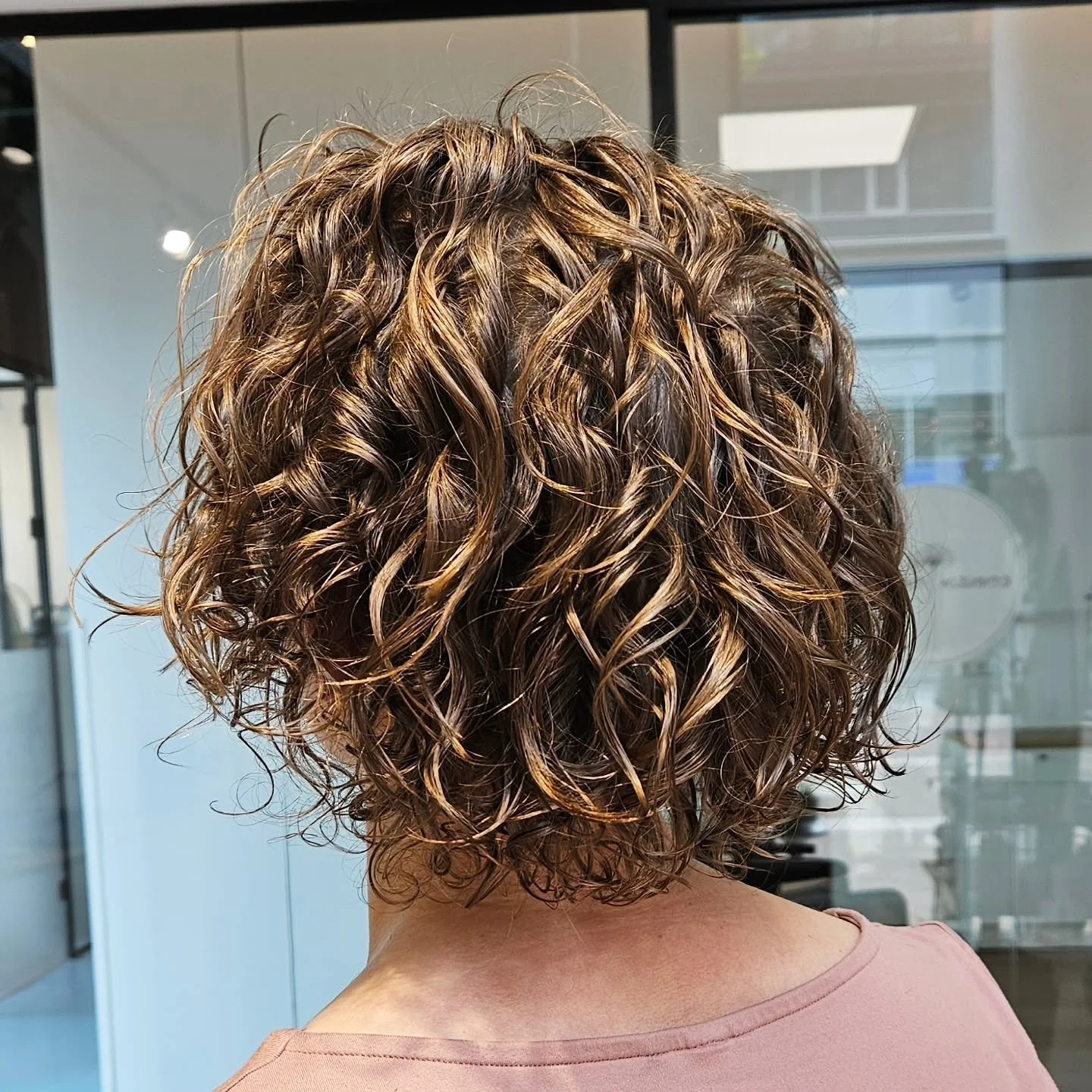 Wavy transformation! Swipe for before >>>>. This was a first time CorneliaCurl Cut for her. We focused mainly on keeping her length as full as possible while starting the process of adding lightness and volume. Can't wait to see what her 