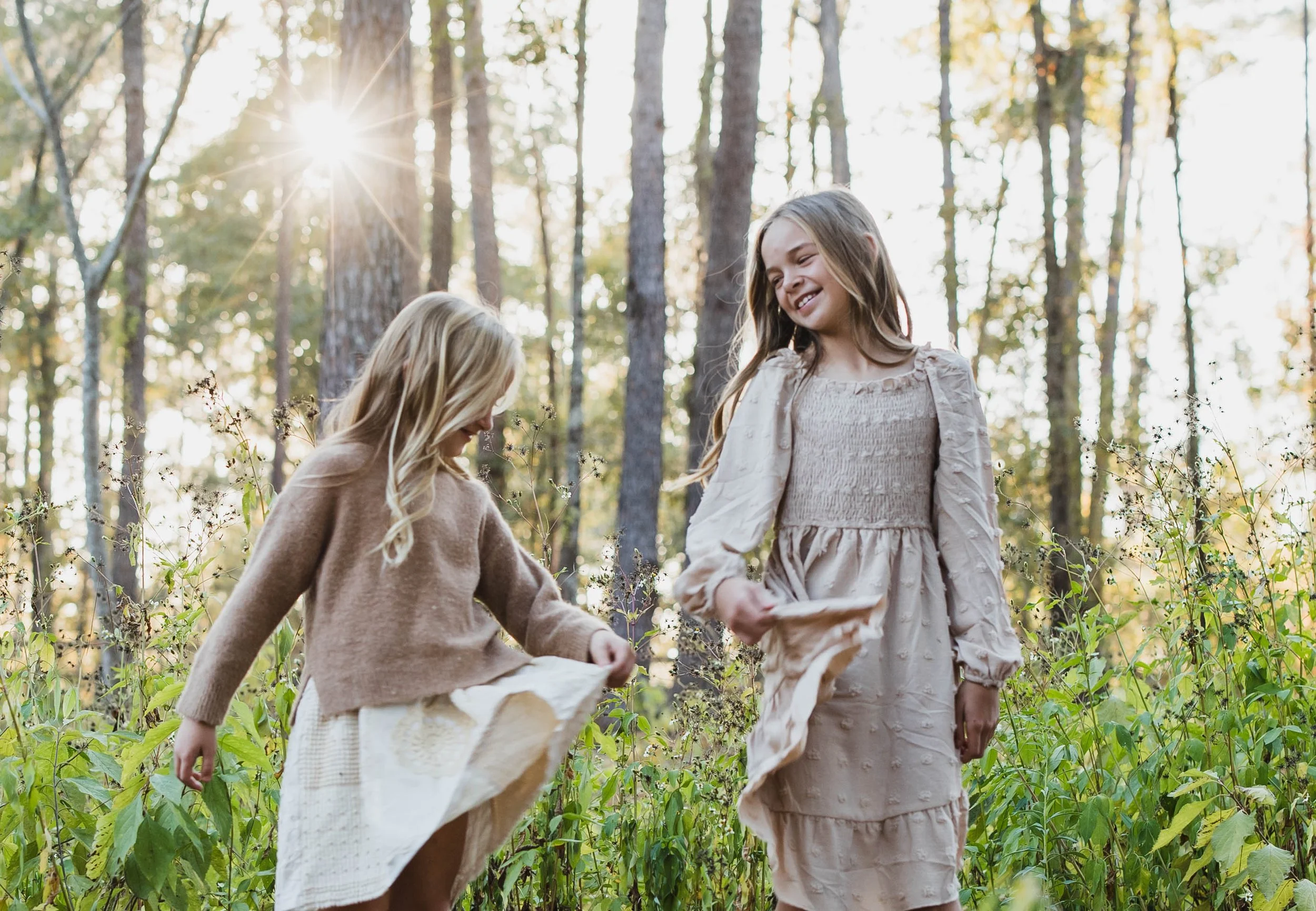 Sisters dancing in the sunlight