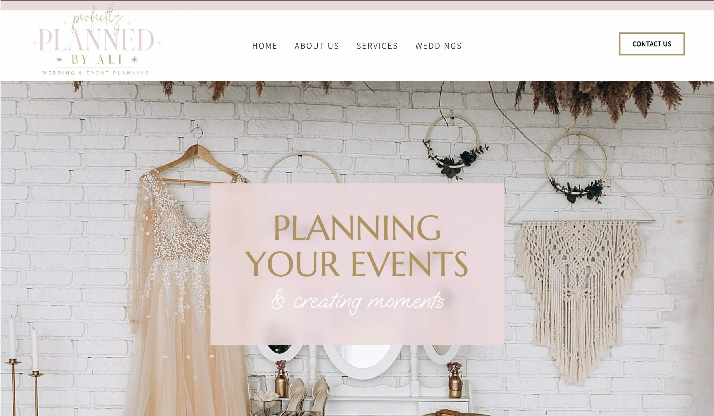 Homepage of a wedding and event planning website with a white brick wall background, decorative clothing and wall hangings, and a pink banner with the text "Planning Your Events & Creating Moments."