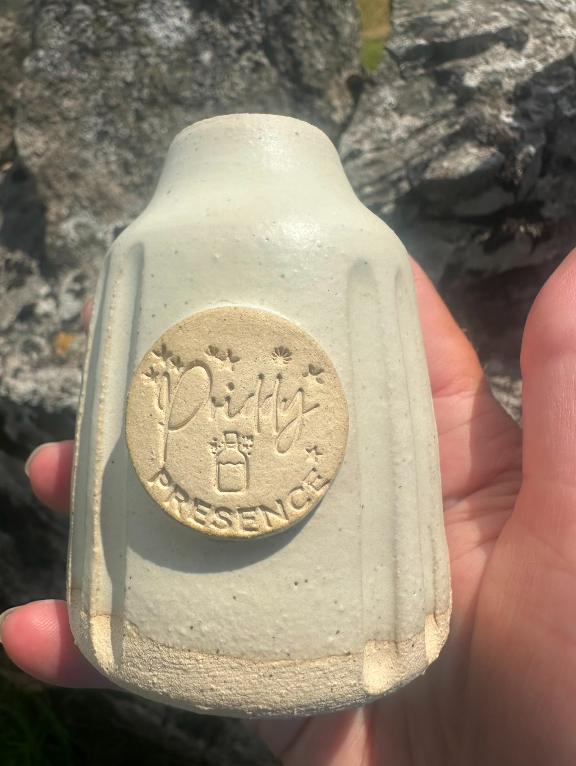 Handmade ceramic reed diffuser crafted by Lowen Clay, with natural reeds and seasonal essential oil blend, part of the Rituals of Presence collection.