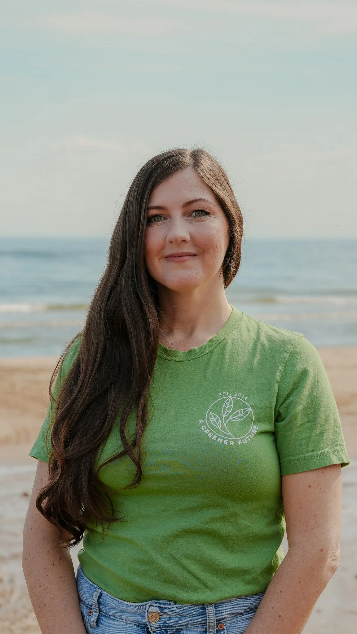 Headshot of Rochelle Byrne in a green t-shirt standing on the beach