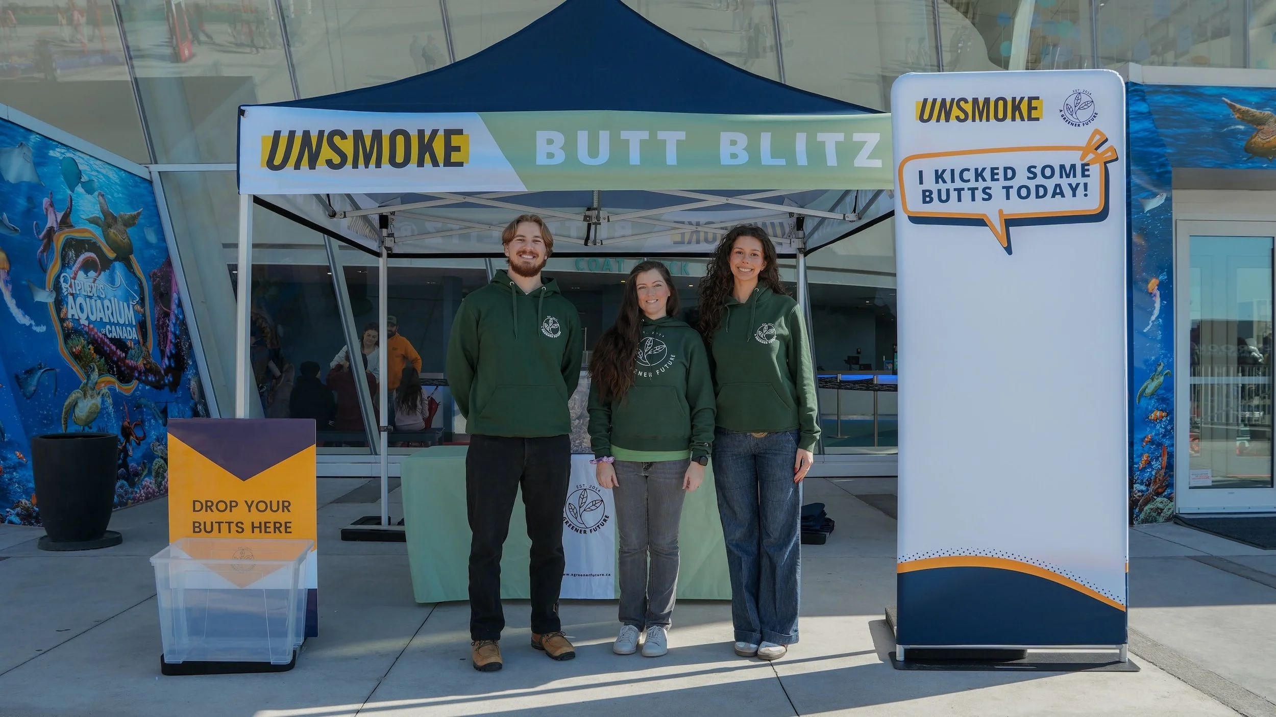 Rochelle, Greg and Recia in front of the Butt Blitz tent at Ripley's Aquarium