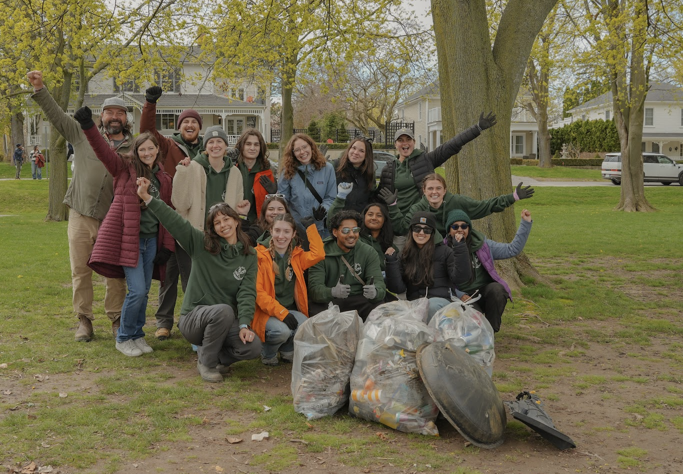 A group photo of the A Greener Future summer and full-time staff posing with trash bags at the end of an event in Queen's Royal Park in Niagara-On-The-Lake on May 1st of 2026.