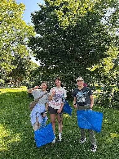 Volunteers participating in a litter cleanup at Trinity Bellwoods Park in Toronto