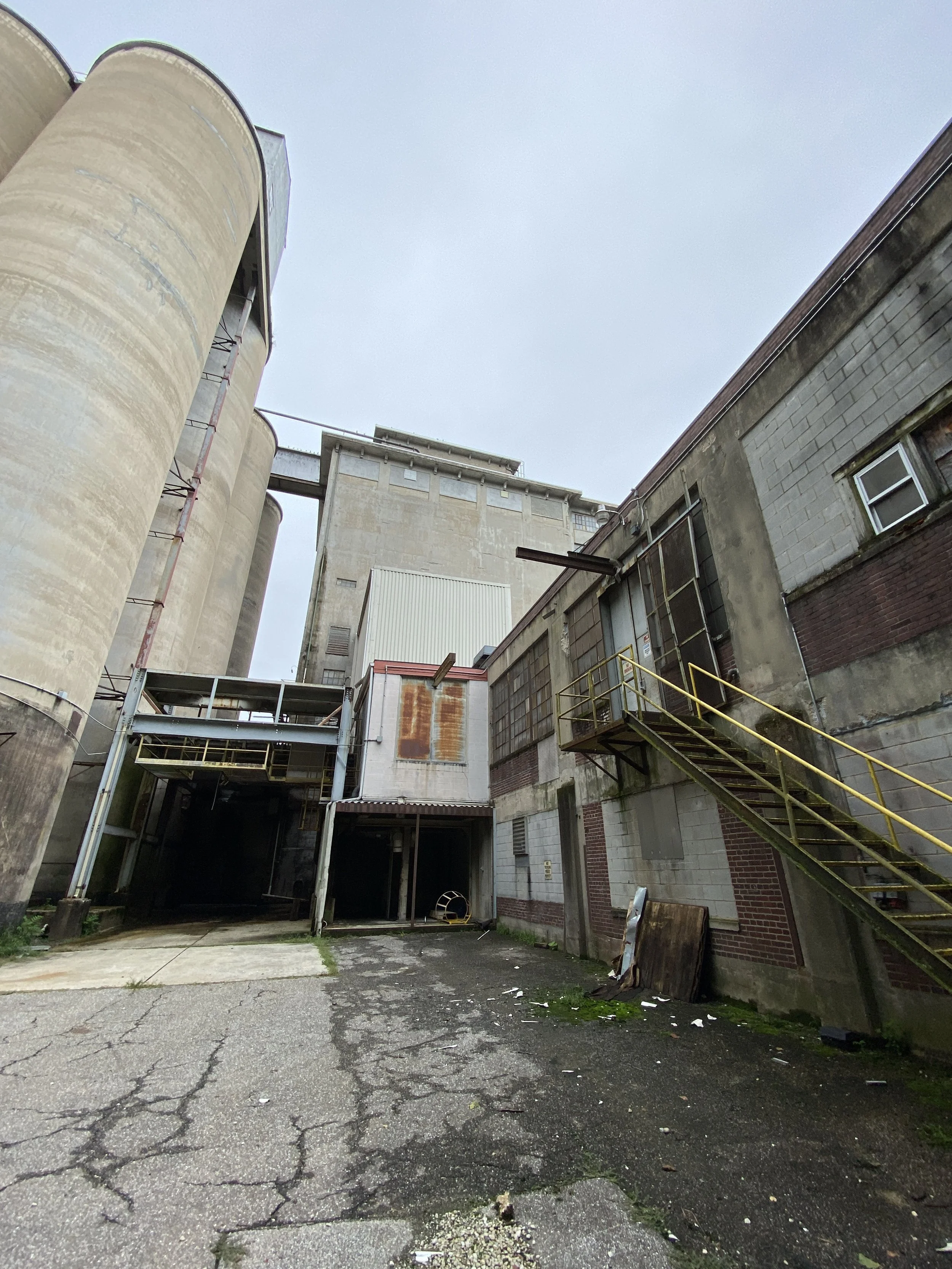 Typical conditions between existing building and silos looking east towards Frederick Road