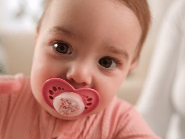  Close up baby portrait with pacifier lifestyle video baby brand NYC 