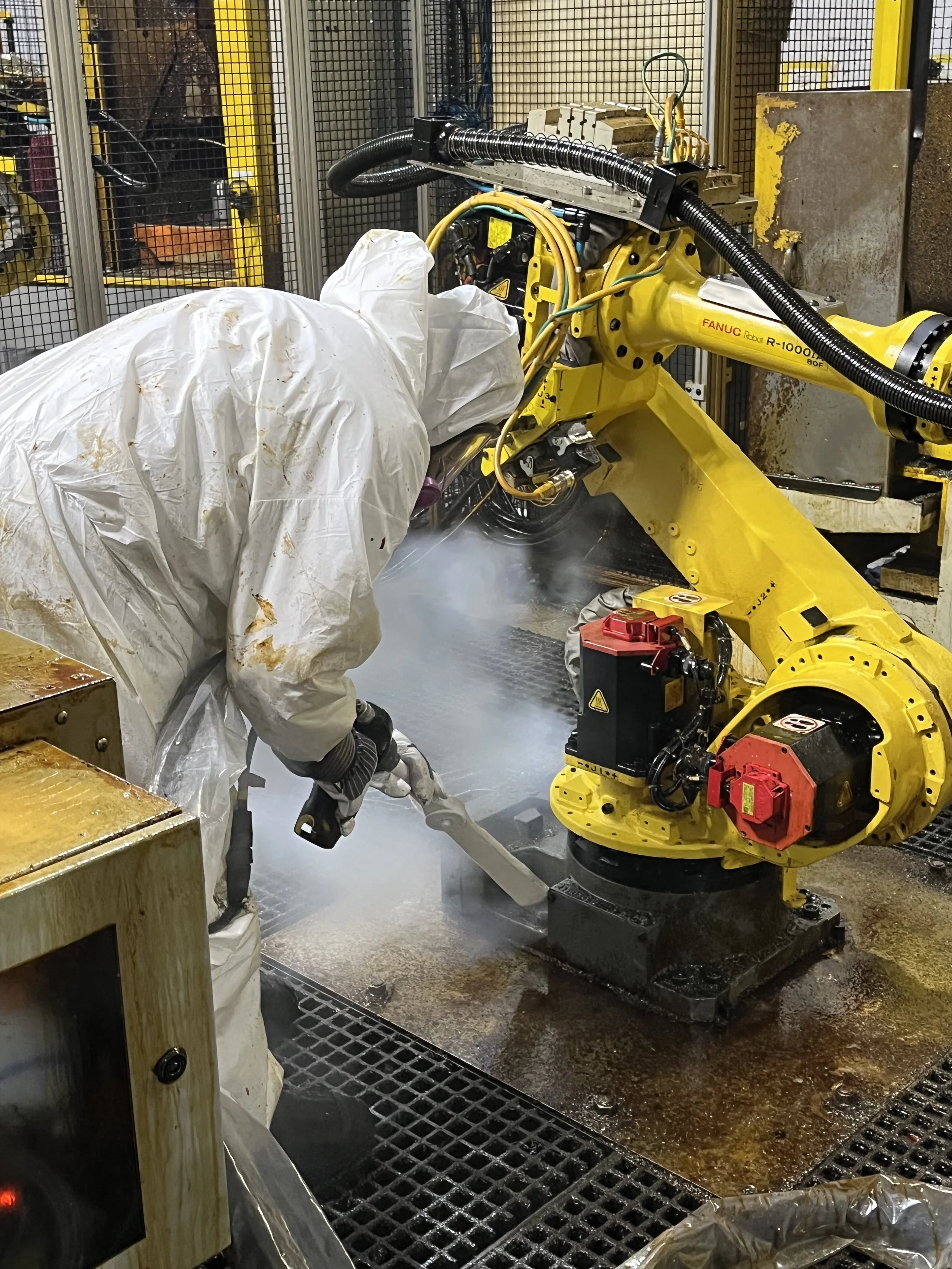 Two workers Dry Ice Cleaning from a man lift.