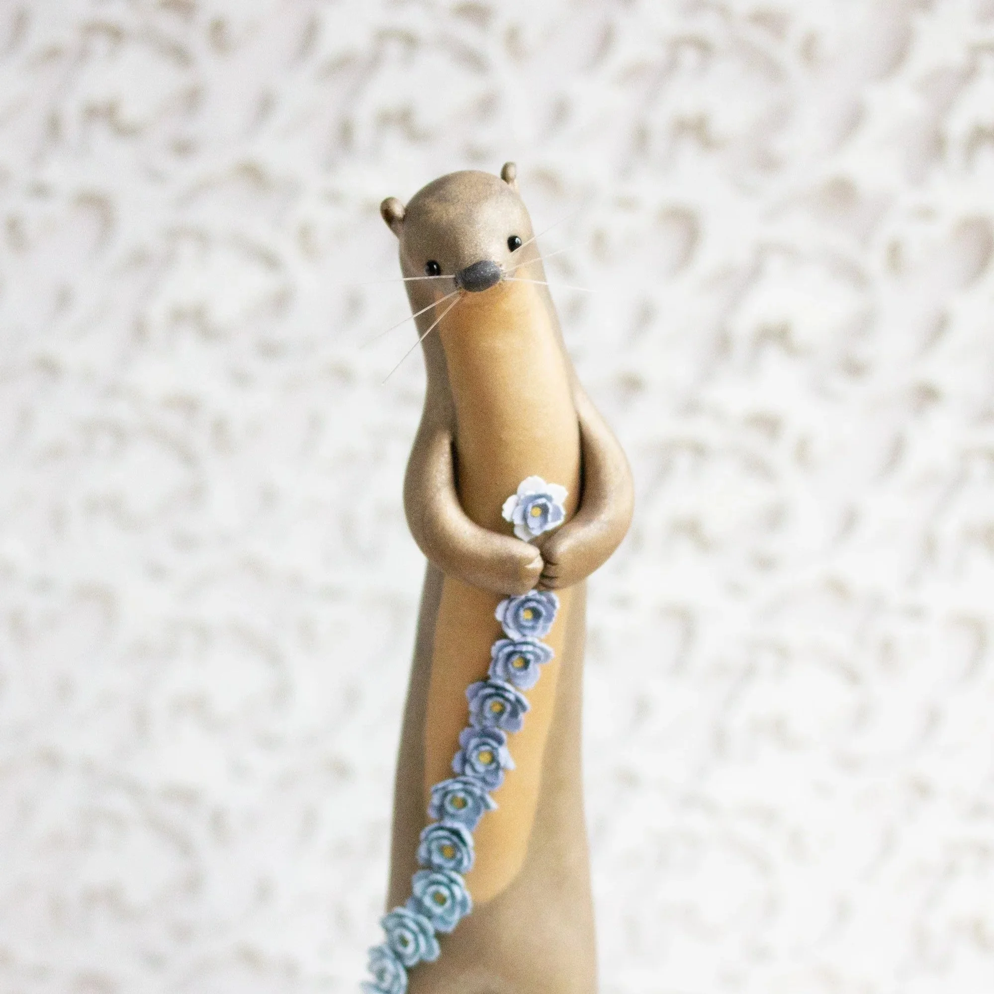 River Otter Makes a Flower Chain - River Otter Figurine