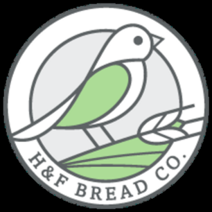 Logo of H&F Bread Co. featuring a stylized bird perched on a branch with green wings.