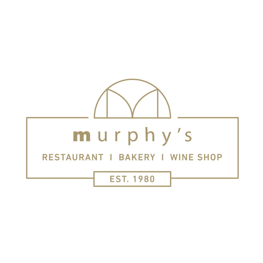 Murphy's restaurant logo with a stylized semi-circle window and text indicating it is a restaurant, bakery, and wine shop established in 1980.
