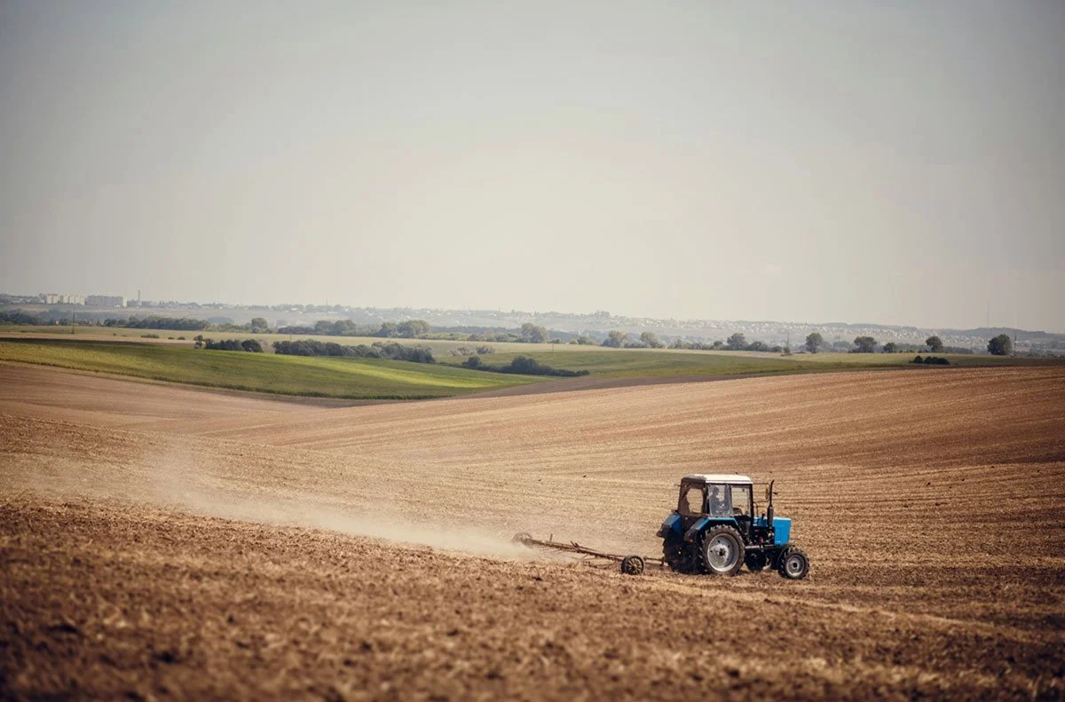 bigstock-Agriculture-Use-Tractor-Plowin-448948969.jpg