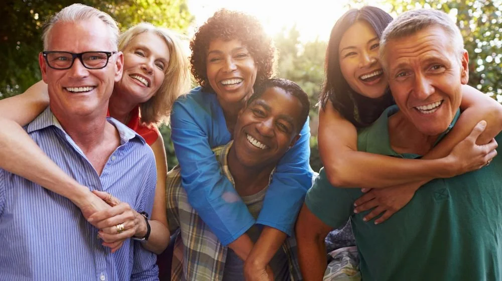 mature-friends-giving-piggybacks-backyard-together-epigenetic-clock-ss-featured.jpg