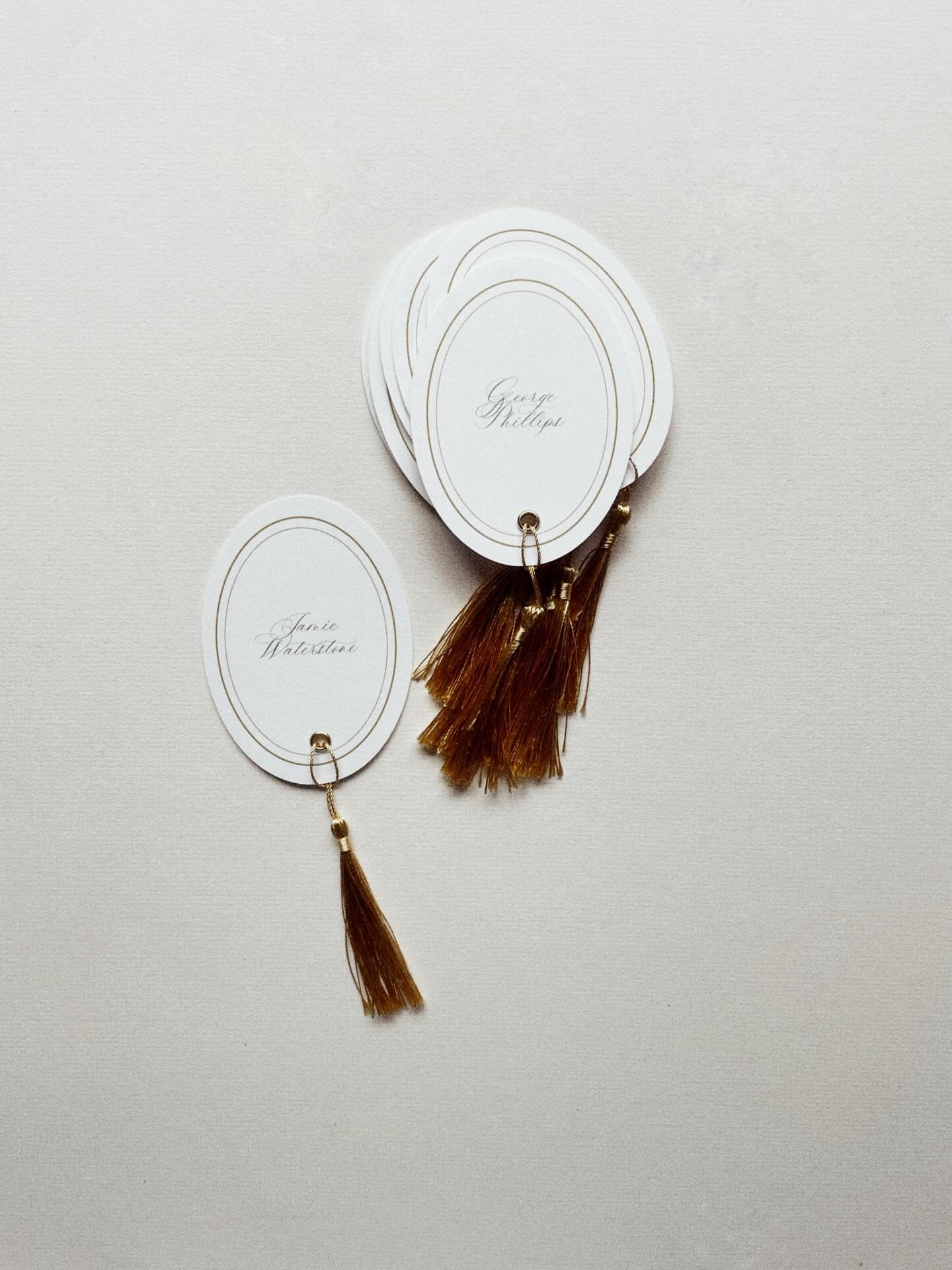 Oval place names finished with luxe gold tassels, add a refined touch to every table setting. A beautiful keepsake for guests and the perfect finishing detail for a classic celebration.

#weddingdetails #placecards #luxurywedding #tablescapeinspirati