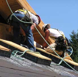 Roofers installing custom sheet metal roofing | Washington State