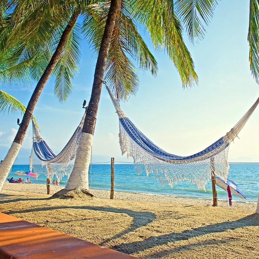 Beachfront hammocks on the Villa Encanto property.