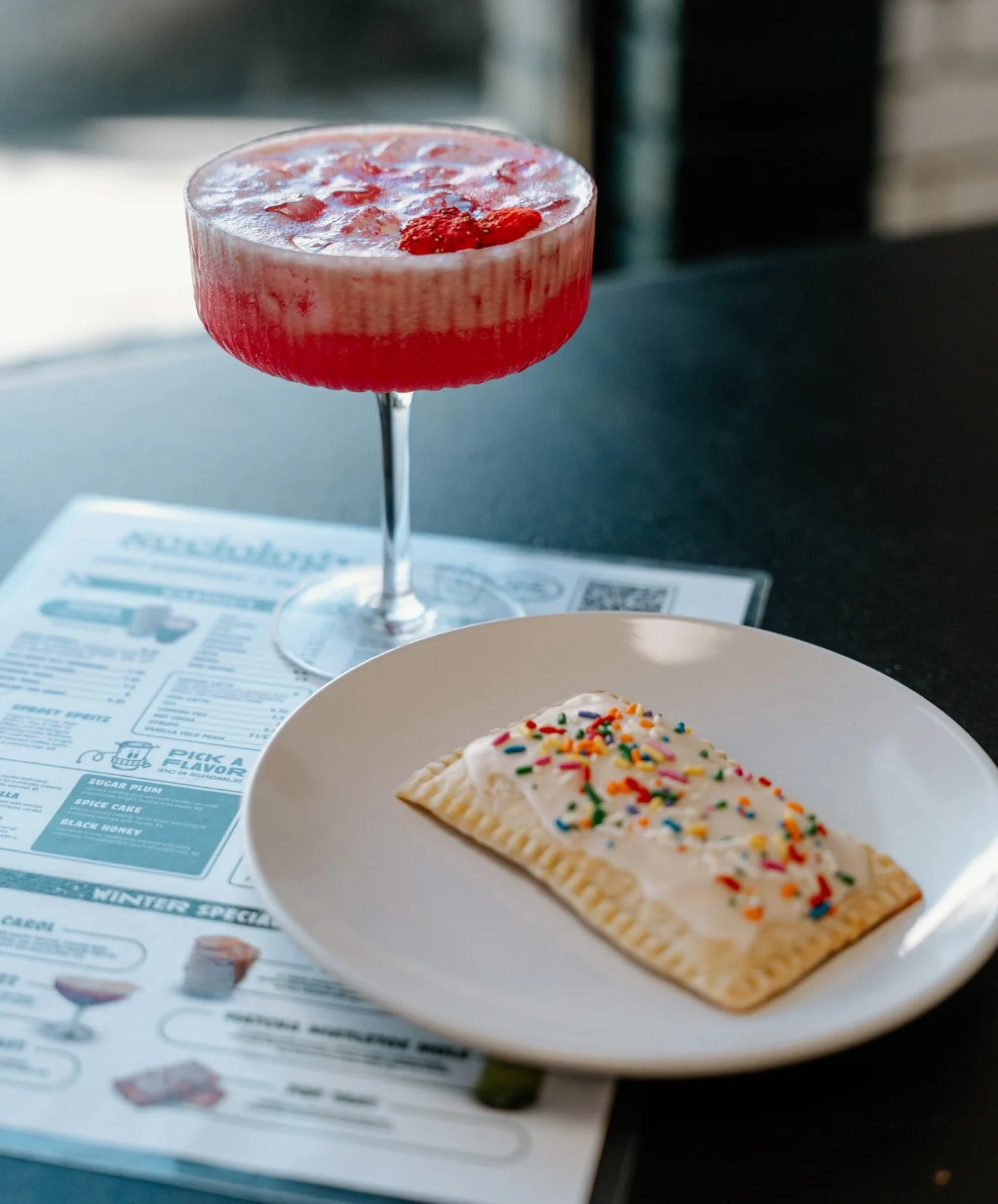 New duo just dropped.

Meet the Strawberry Bubblegum. Strawberry puree, lime, Maple Pancakes syrup, sparkling water, and edible shimmer because normal drinks are boring. ✨

Pair it with the Tropical Pop Tart. Housemade with fruit jam, coconut lime fr