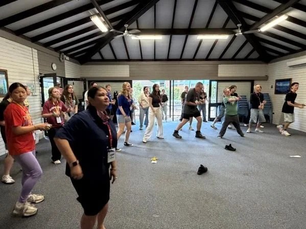 Young people dancing at a camp