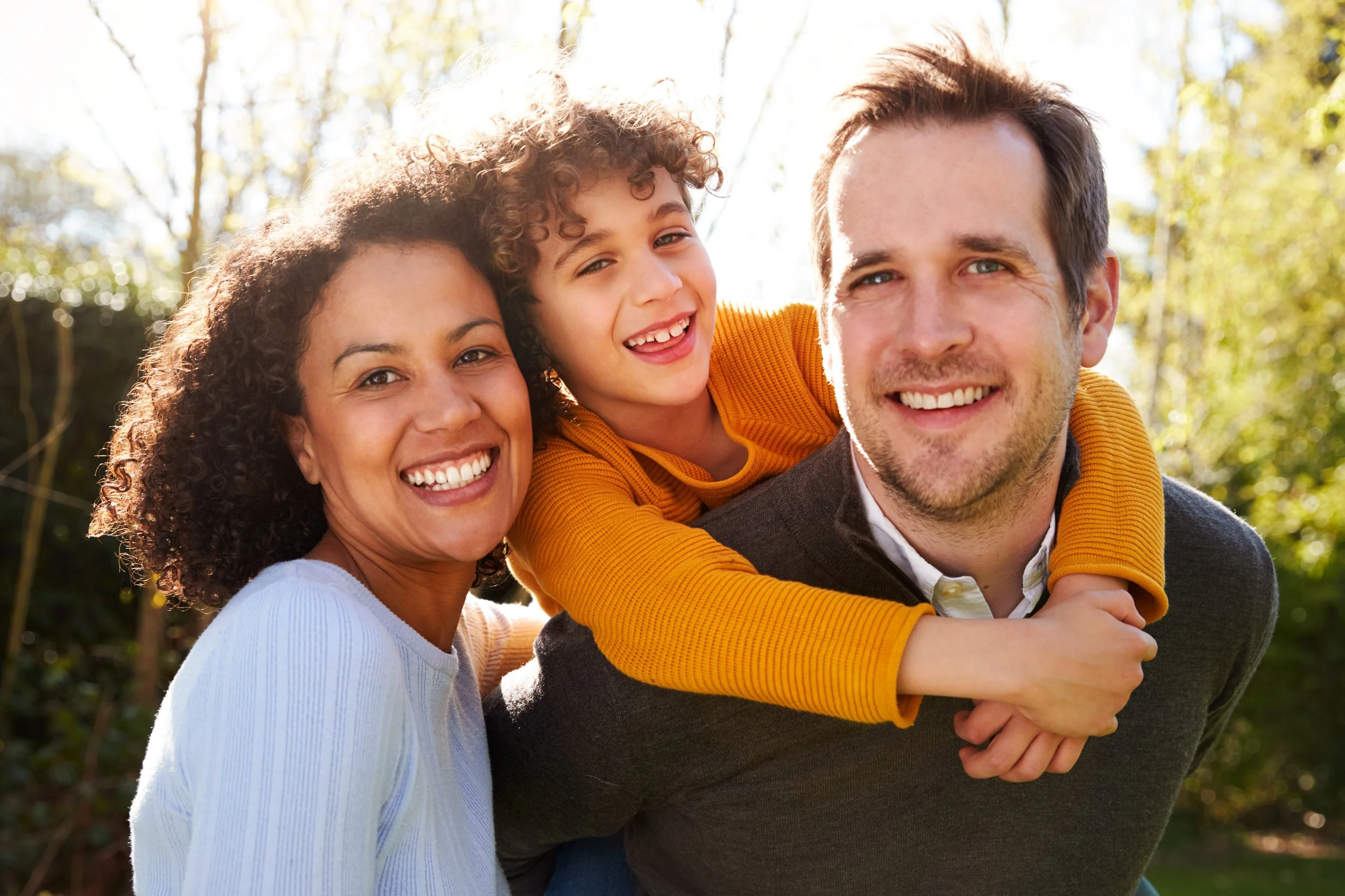 Family riding safely in a car with seatbelts buckled