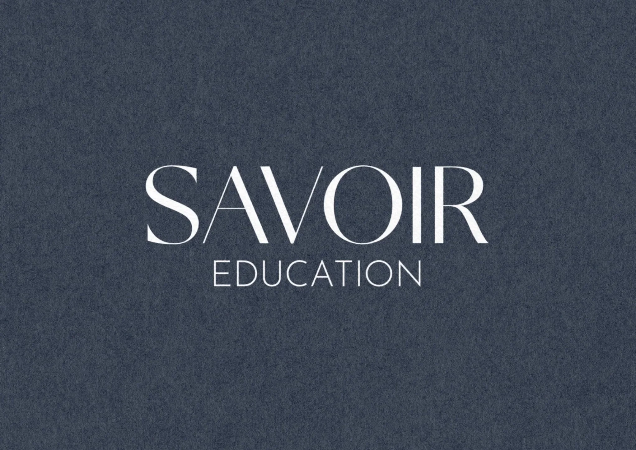 Savoir Education wordmark logo design on textured background.