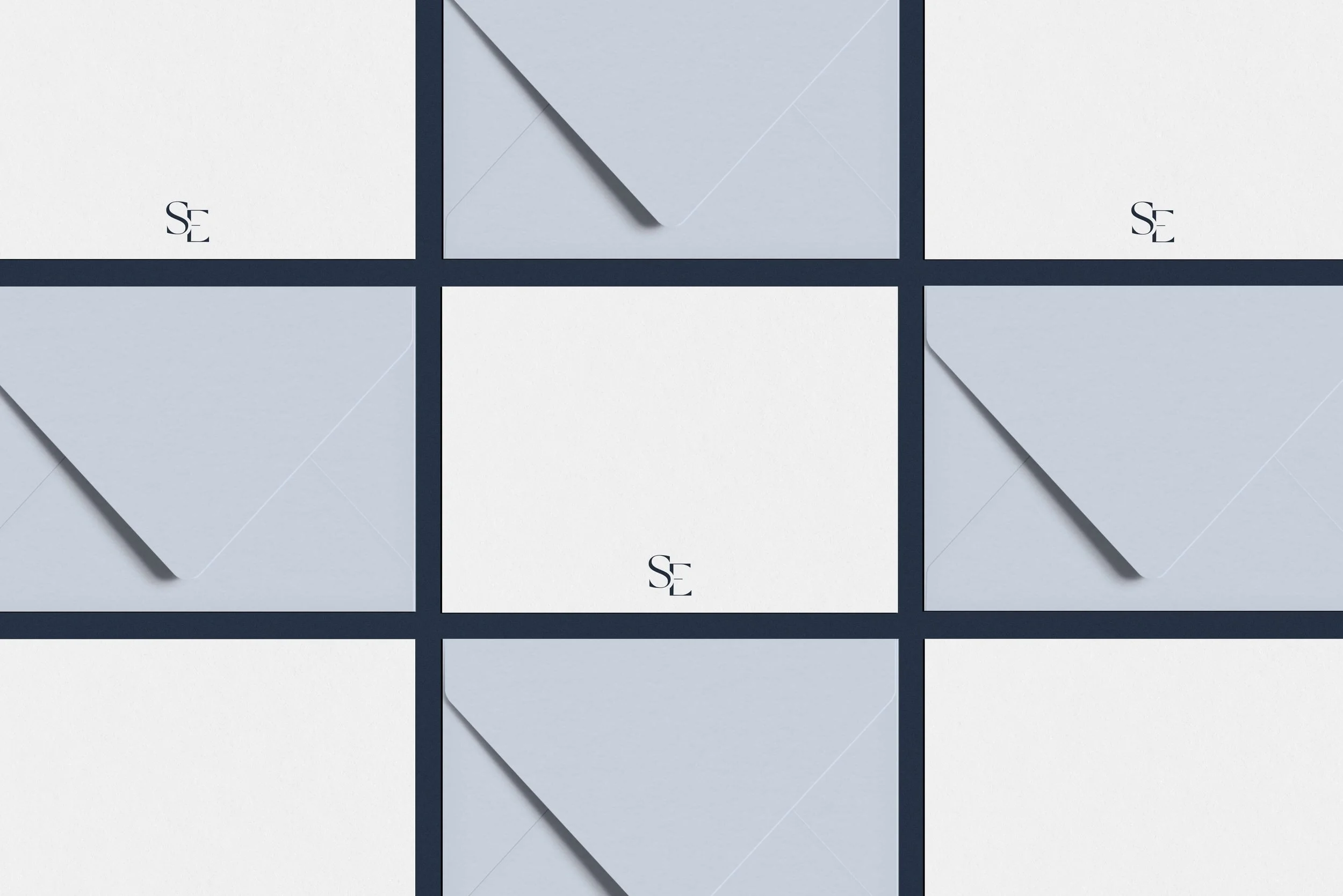Savoir Education stationery design — SE monogram on envelopes and cards