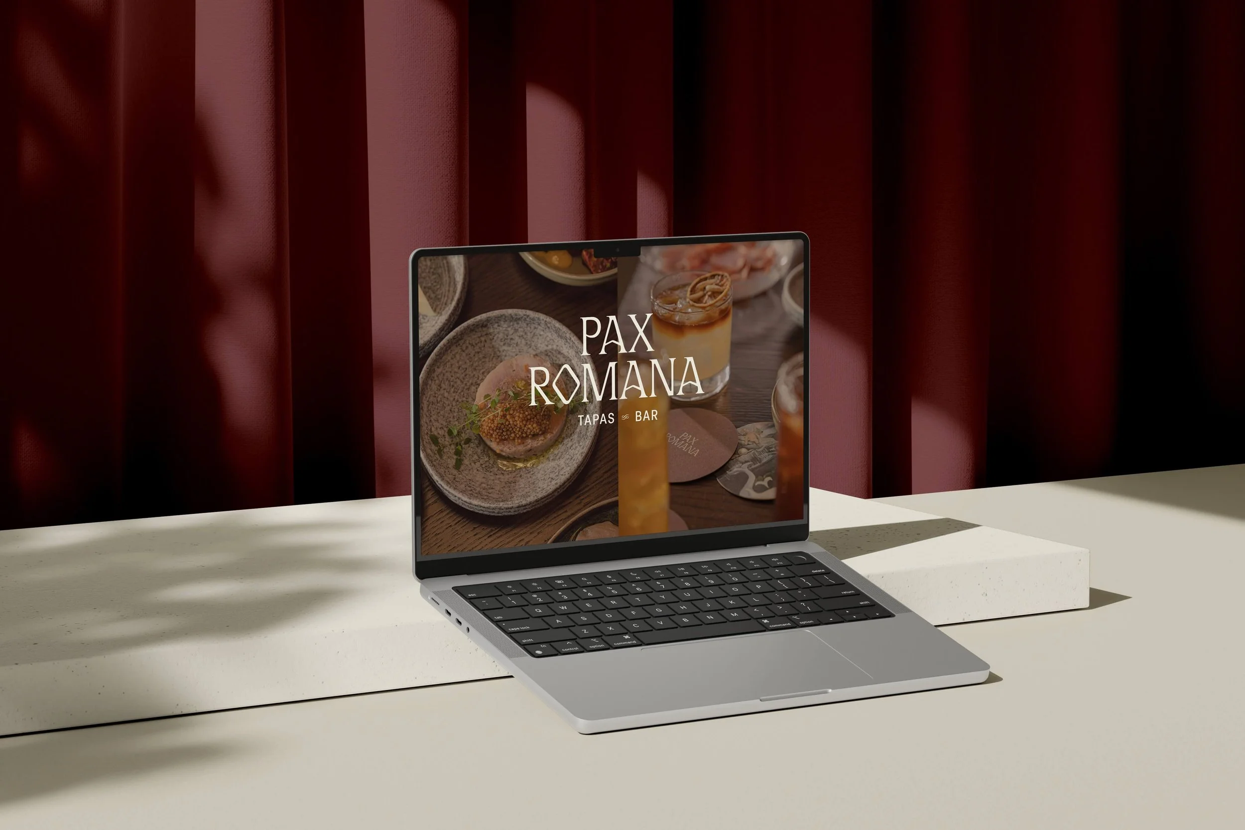Pax Romana Squarespace website design shown on laptop mockup