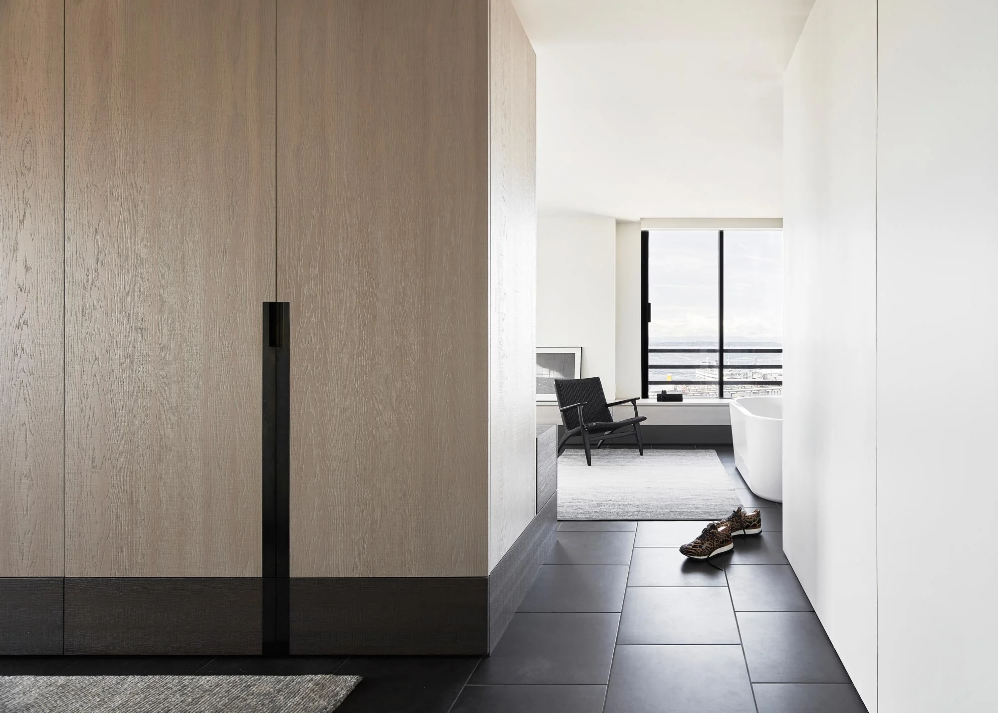 Custom closet casework, hardware, freestanding tub, frameless doors, view condo