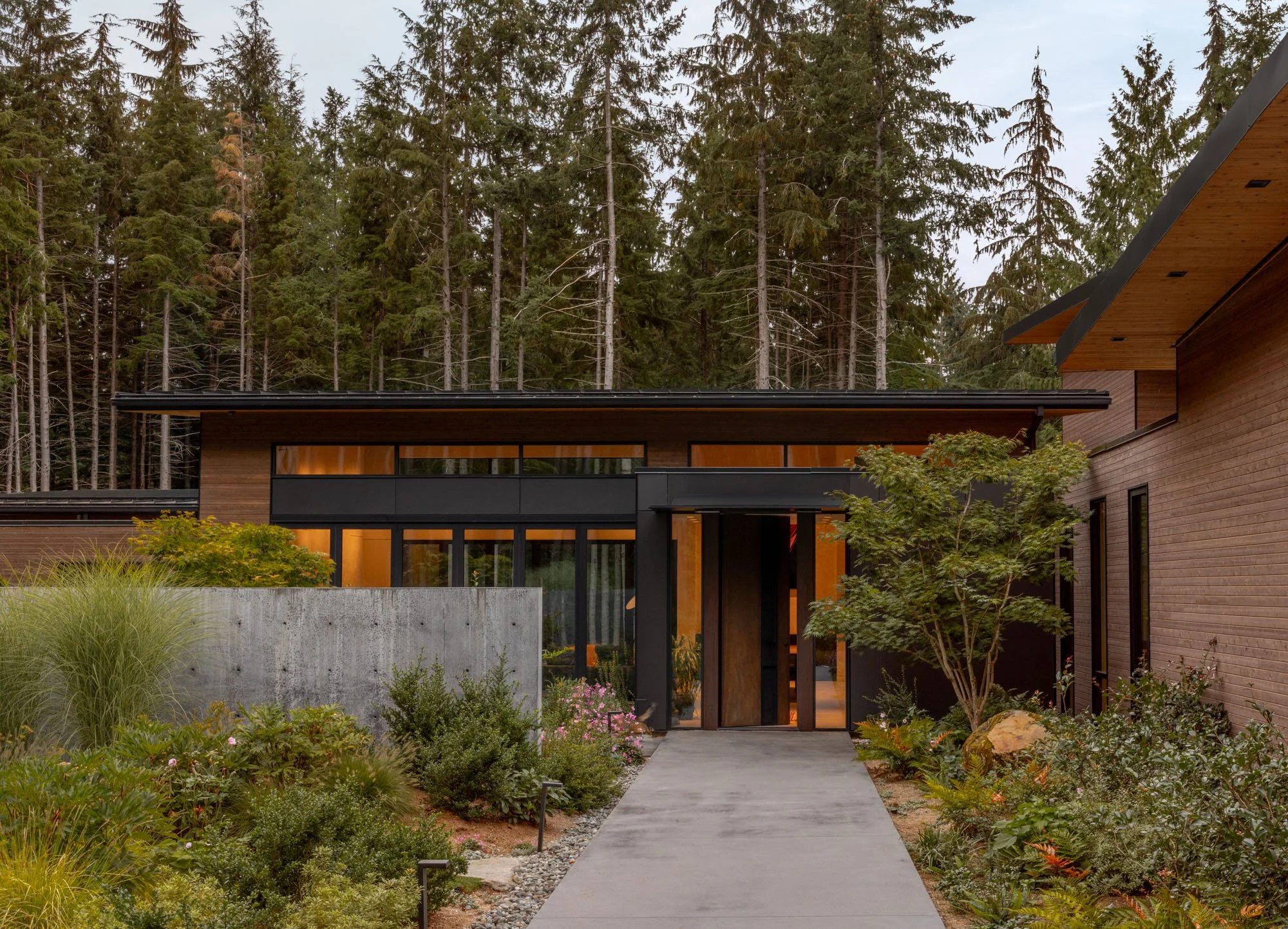 Modern cabin entry door, cast in place concrete entry garden wall