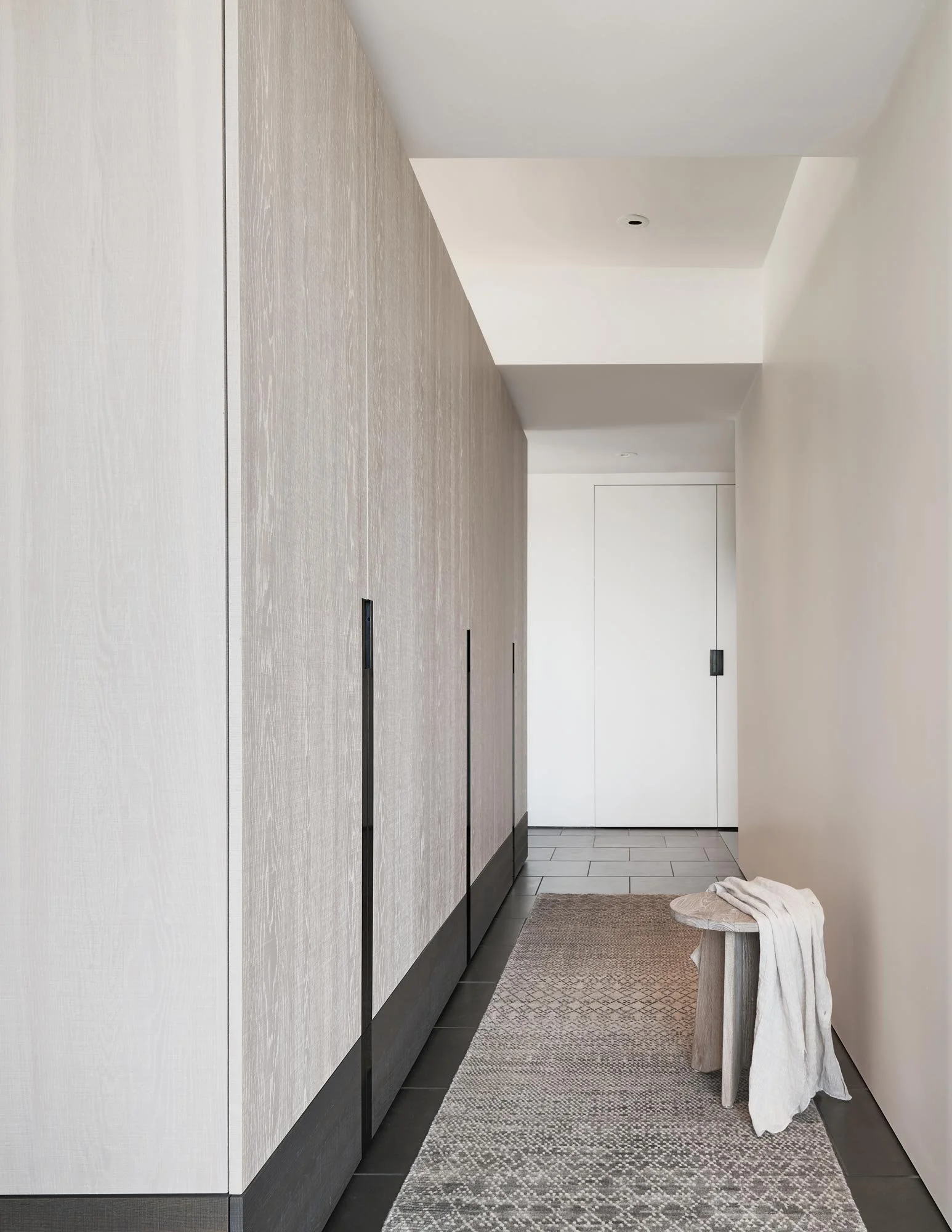 Walk thru closet, custom casework, frameless door, minimalist architectural detailing