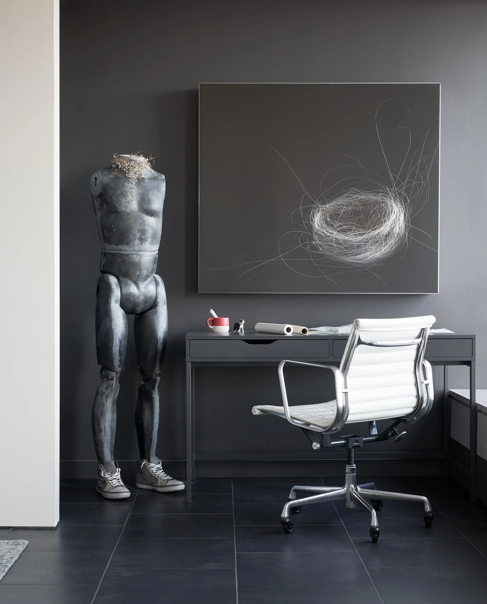 Penthouse office, Eames leather office chair with home offcie desk, working with art, black tile floors