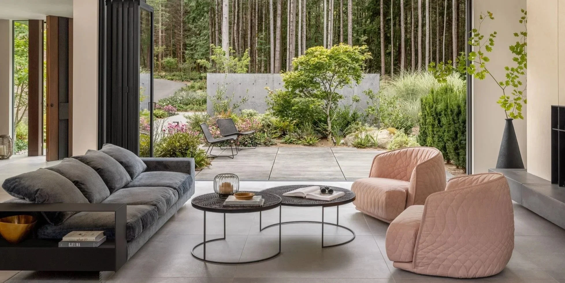 Living room connected to exterior garden, caste in place concrete garden wall
