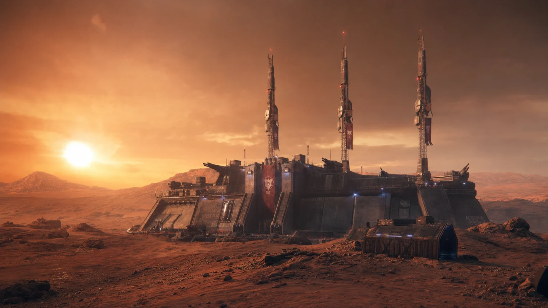 Fortified bunker on a red desert plain with three tall transmitter towers behind it