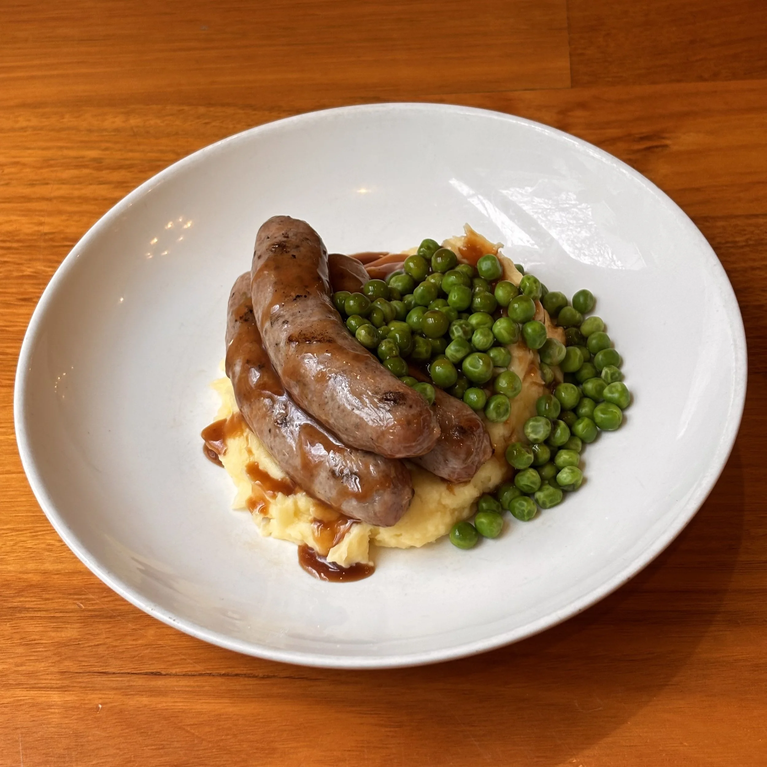 Juicy snags and pillowy mash for $24. Friday only.