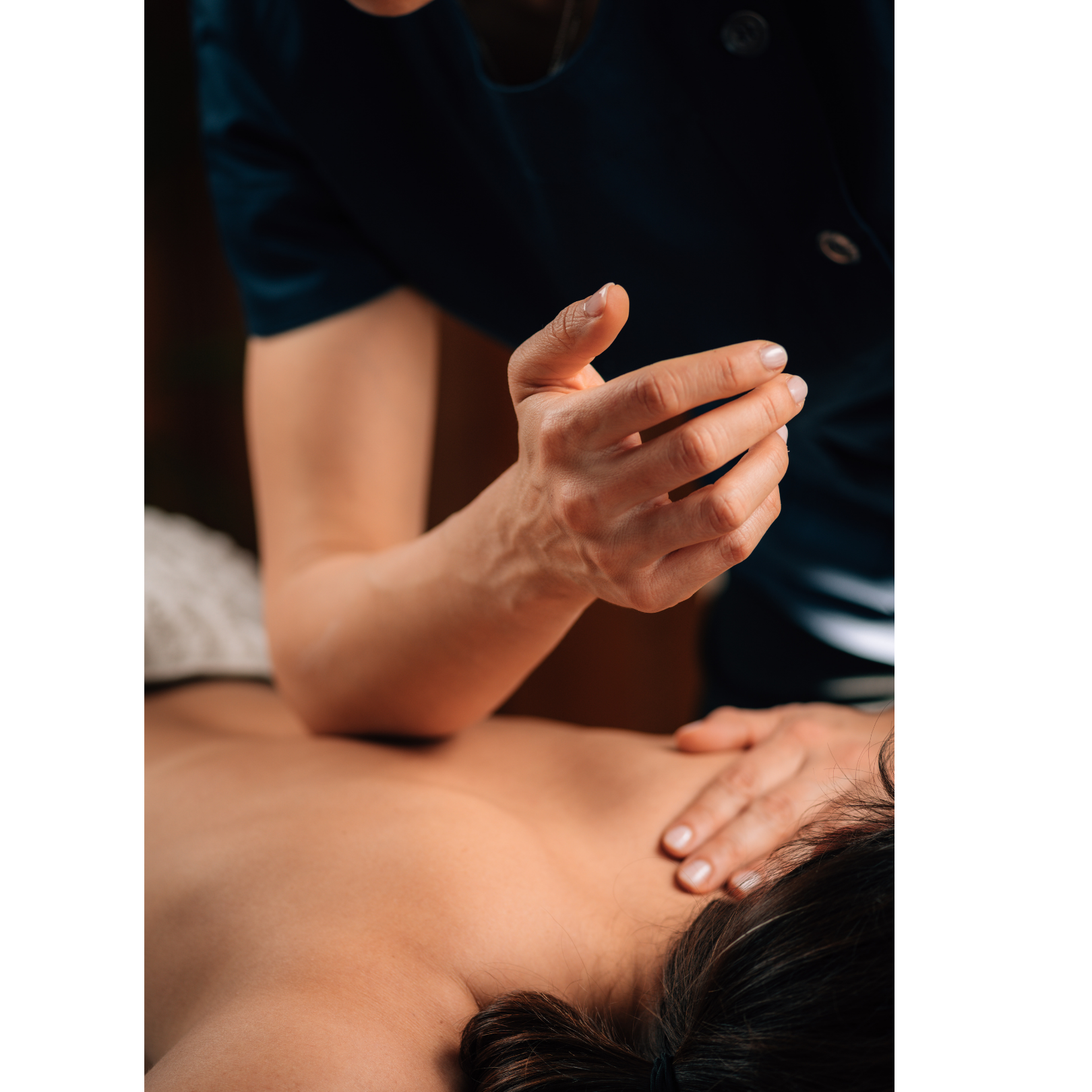 A massage therapist applying firm pressure and targeted techniques to deliver a deep tissue massage, focusing on muscle tension release and therapeutic benefits.