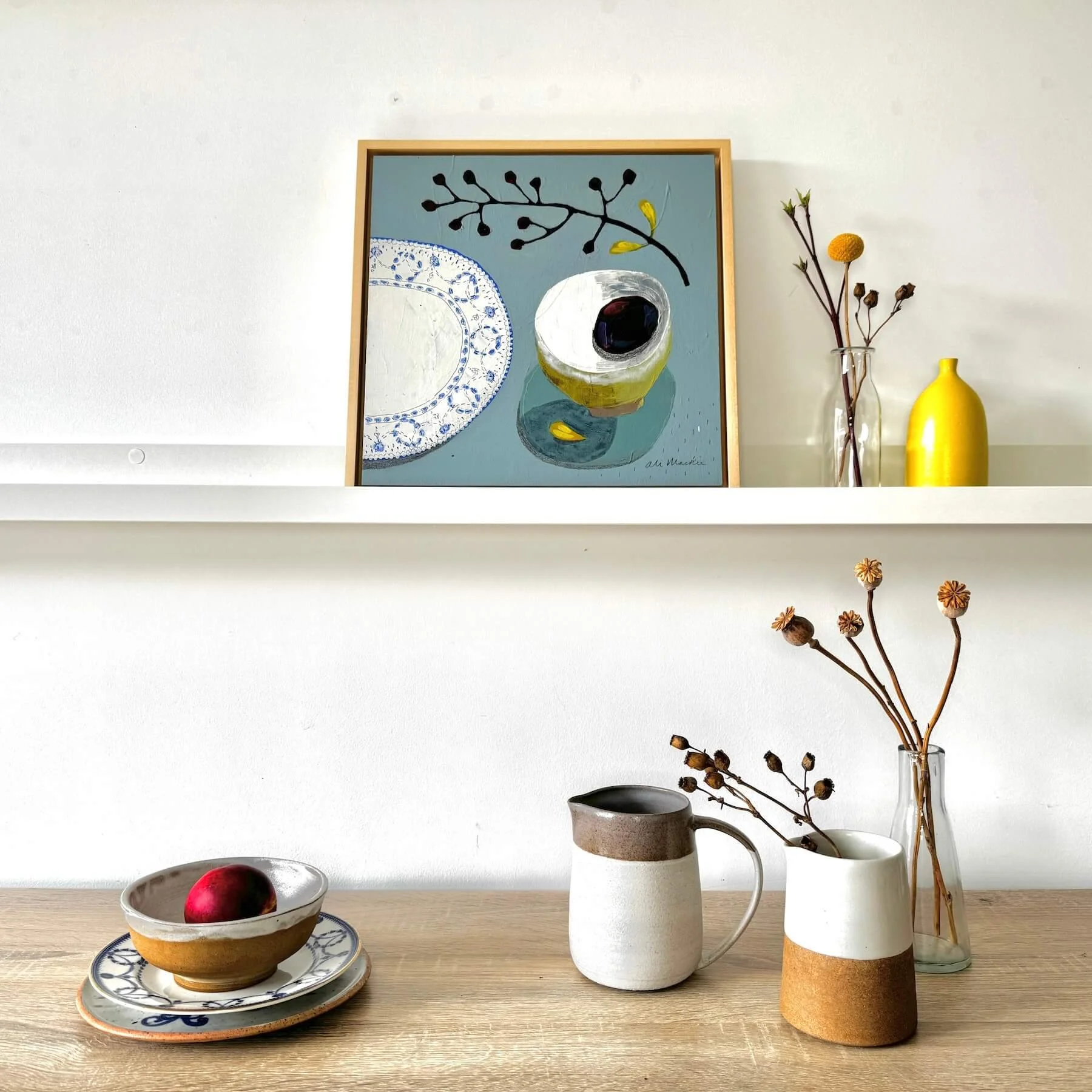 ali-mackie-art-lets-sit-together-framed-still-life-painting-interior.JPG