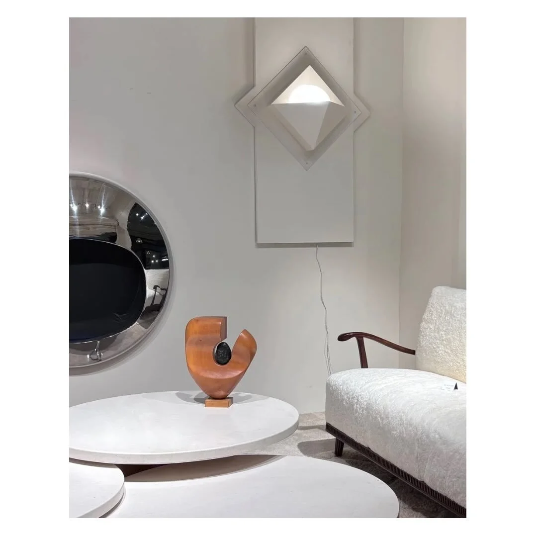 The endless treasure trove. Objects in conversation with each other, from different times, different makers, different worlds.

The curved wall mirror watching over all of it. Quietly holding the room together.

Another conversation we couldn&rsquo;t