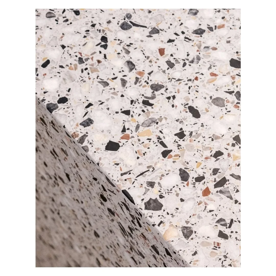Kitchen counter, up close and in context.

The terrazzo countertop from our Jordaan project. A material chosen for how it behaves in different light, how it sits alongside the walnut, and how it feels underhand.

We love the variety of colour tones, 